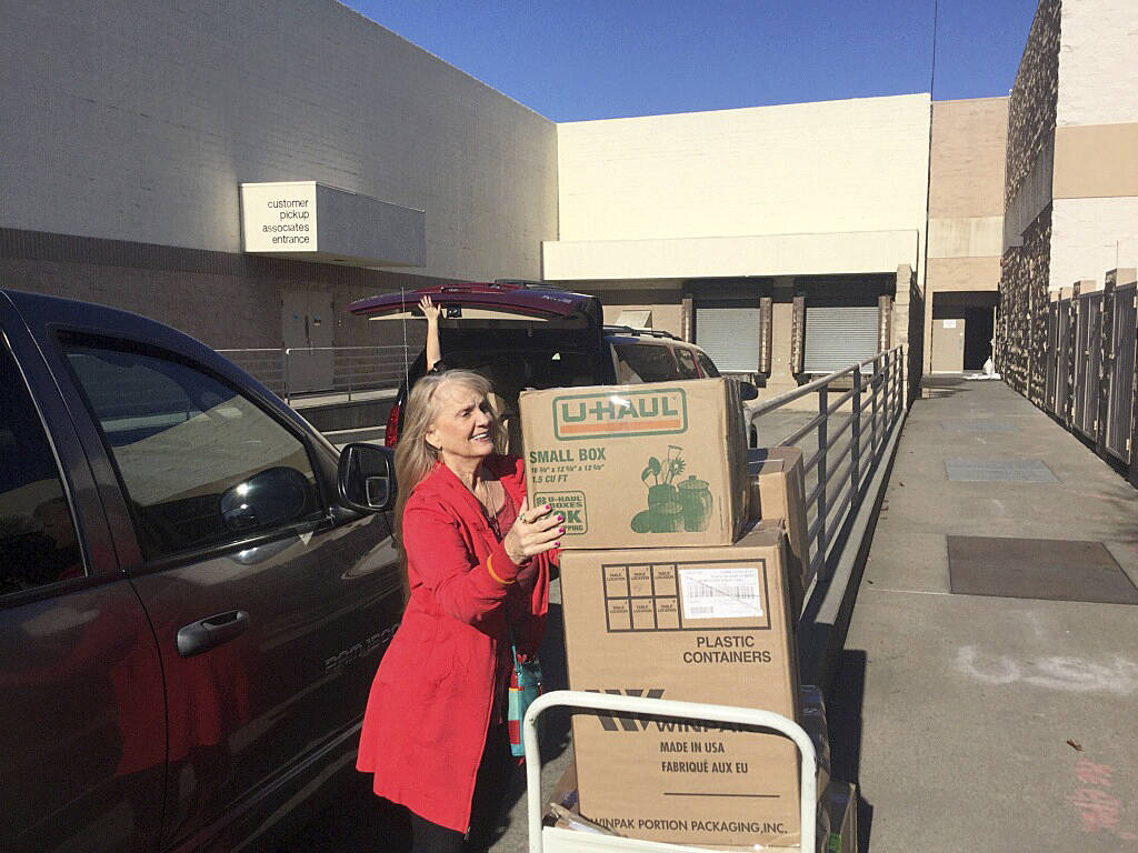 Photo provided .                                &lt;em&gt;Linda French was the clothing representative who first contacted Nunn with Dove Detches’ idea to open up a free-of-charge boutique collection for donation. Here, she helps load boxes of clothes that will be given away.&lt;/em&gt;