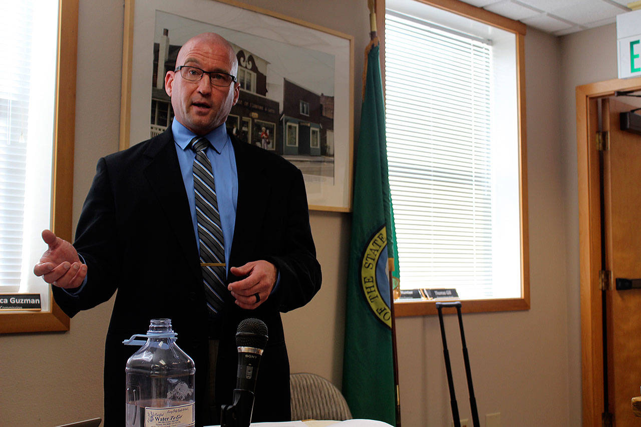 Photo by Patricia Guthrie/Whidbey News Group.                                Robert Glen Carpenter, used a consulting expert in use of force by law enforcement officers, delivers his report on Langley Police Chief David Marks at a city council meeting in June.