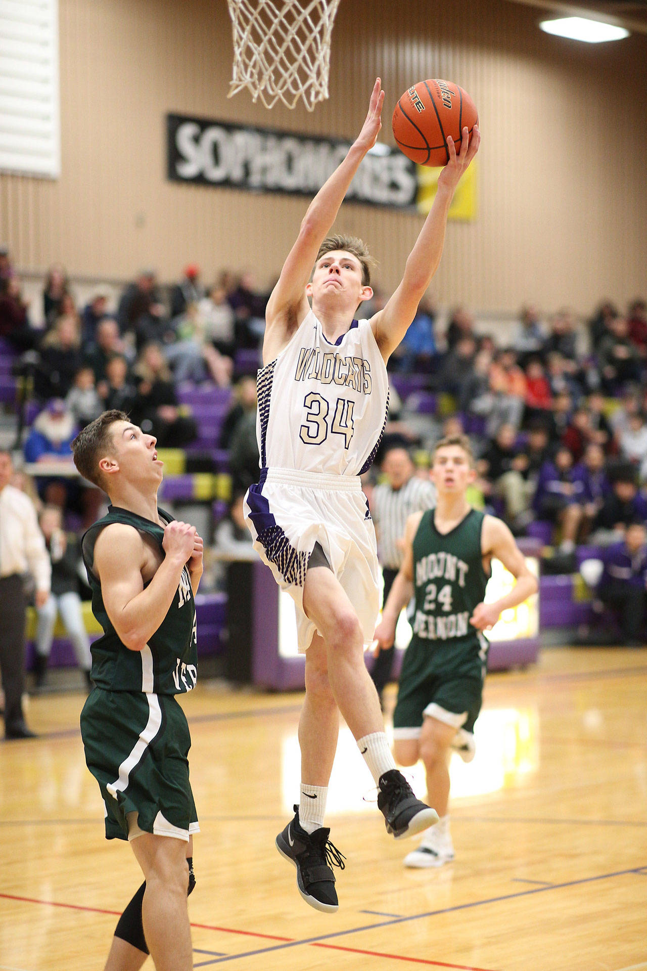 Kevin Schuldt scores 2 of his 7 first-quarter points against Mount Vernon Friday.(Photo by John Fisken)