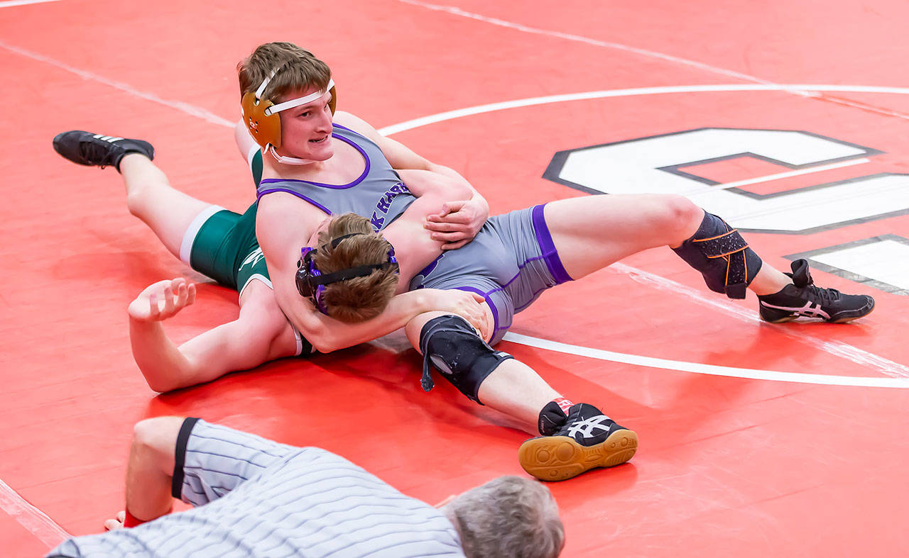Thibault Simorato, right, attempts to pin Russell Hare of Edmonds-Woodway.(Photo by John Fisken)