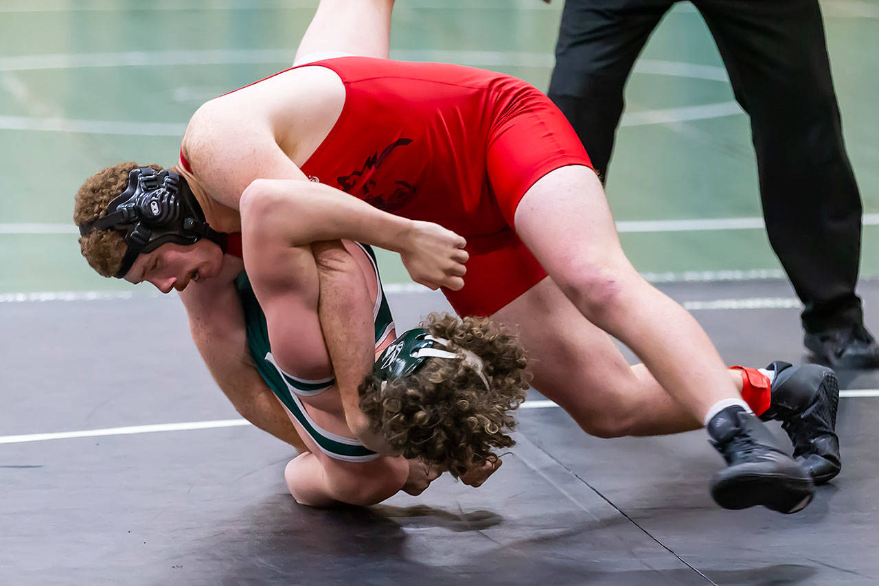 Coupeville’s Alex Turner, top, turns Edmonds-Woodway’s Charlie Horn for a first-period pin.(Photo by John Fisken)