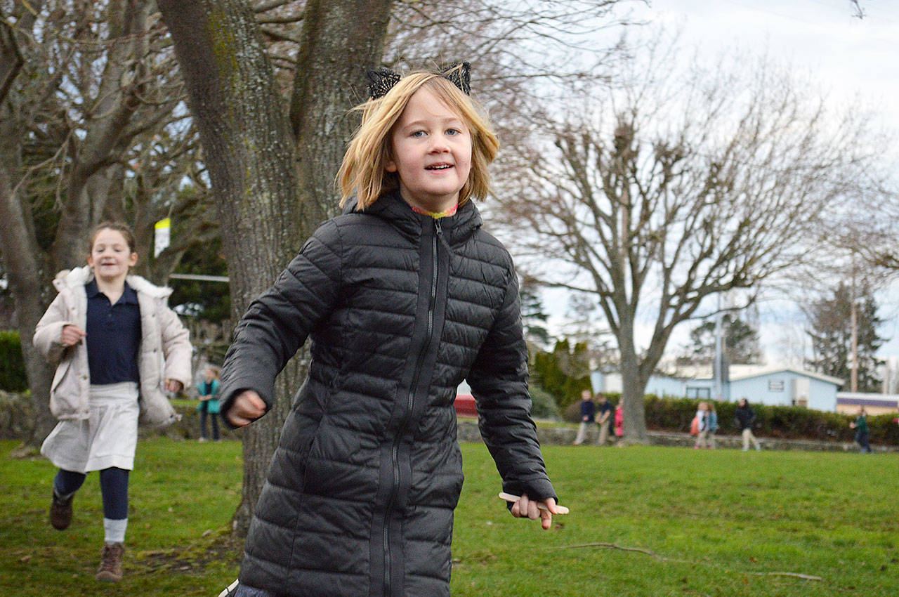 Veda Wray completes a lap Thursday morning at Oak Harbor Elementary School as part of the new Marathon Kids running club. Photo by Laura Guido/Whidbey News-Times