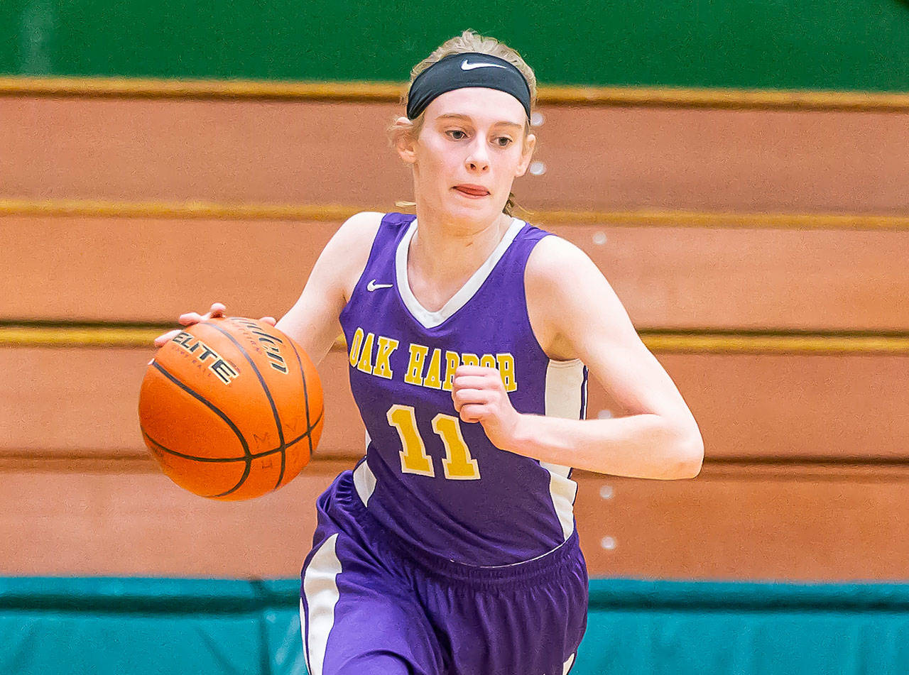 Wildcat point guard Olivia Waie not only leads the Wildcats but excels in the classroom at Oak Harbor High School. (Photo by John Fisken)