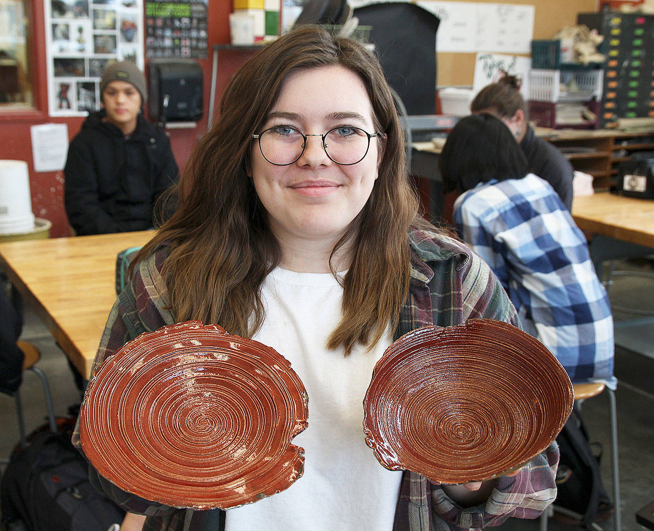 Senior Emma Hanson and her gold-key winning plate and bowl set. Photo by Laura Guido/Whidbey News-Times