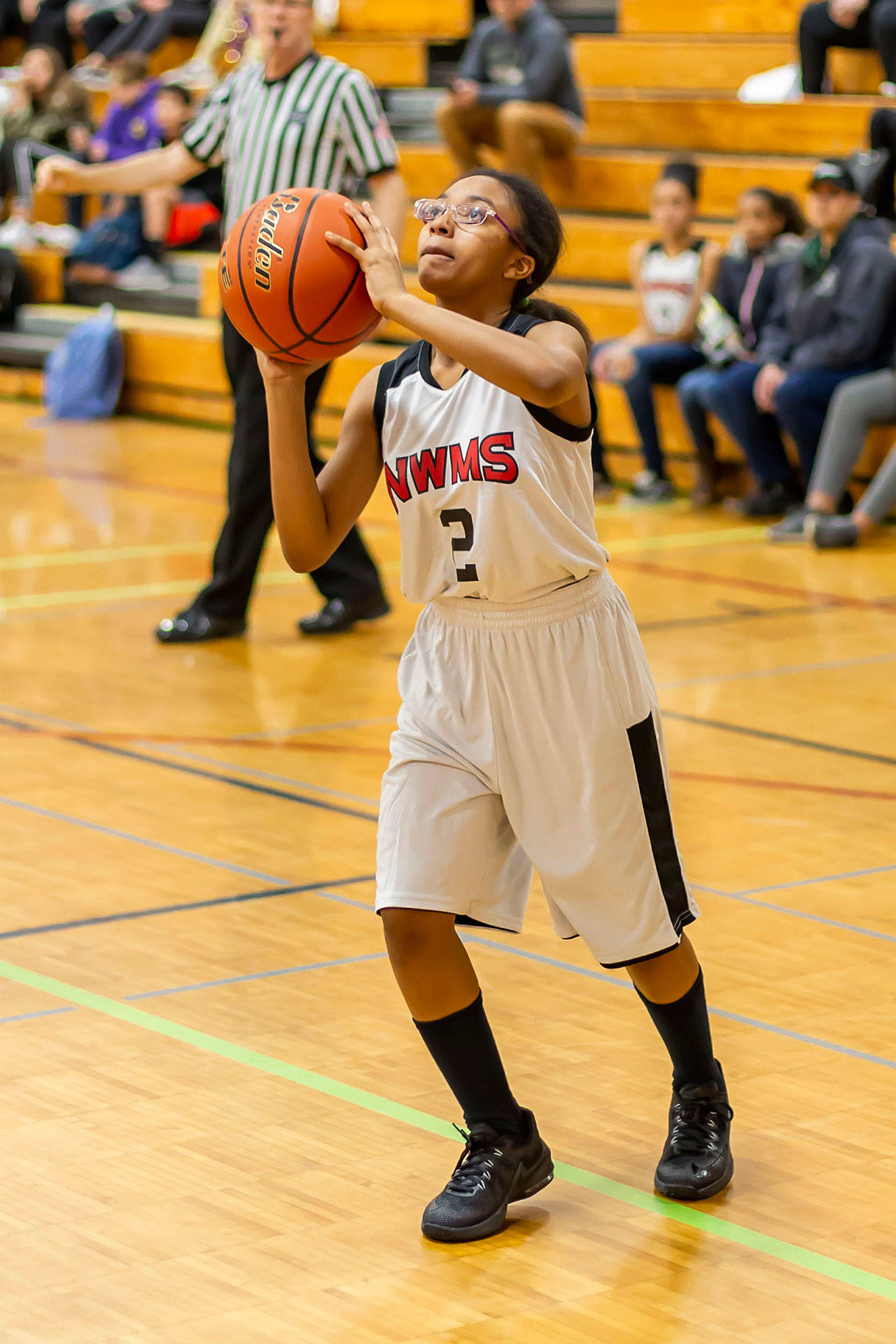 Seventh-grader Ayannah Garcia takes aim at the hoop. (Photo by John Fisken)