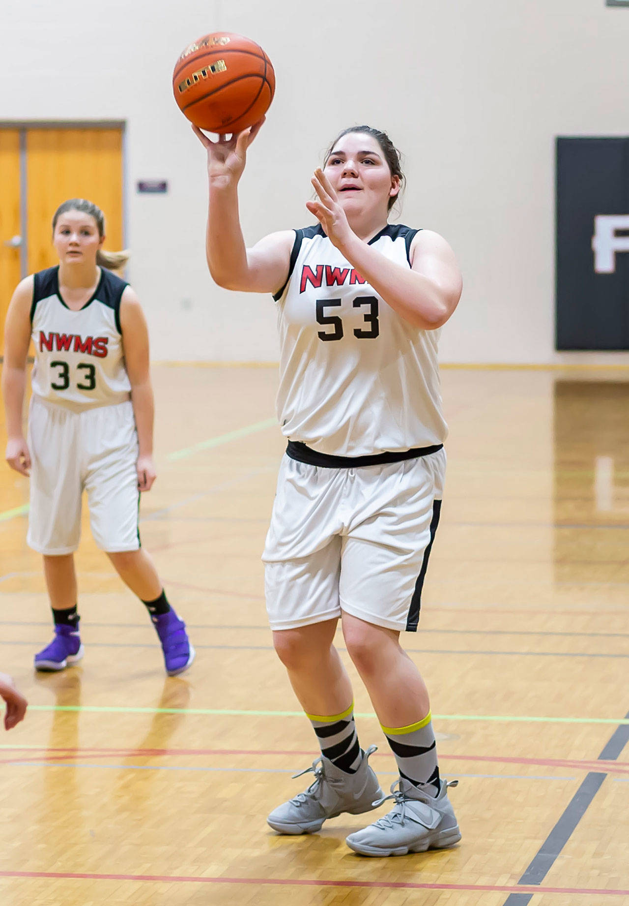 Eighth-grader Grace Odeneal shoots from the free throw line for North Whidbey. (Photo by John Fisken)
