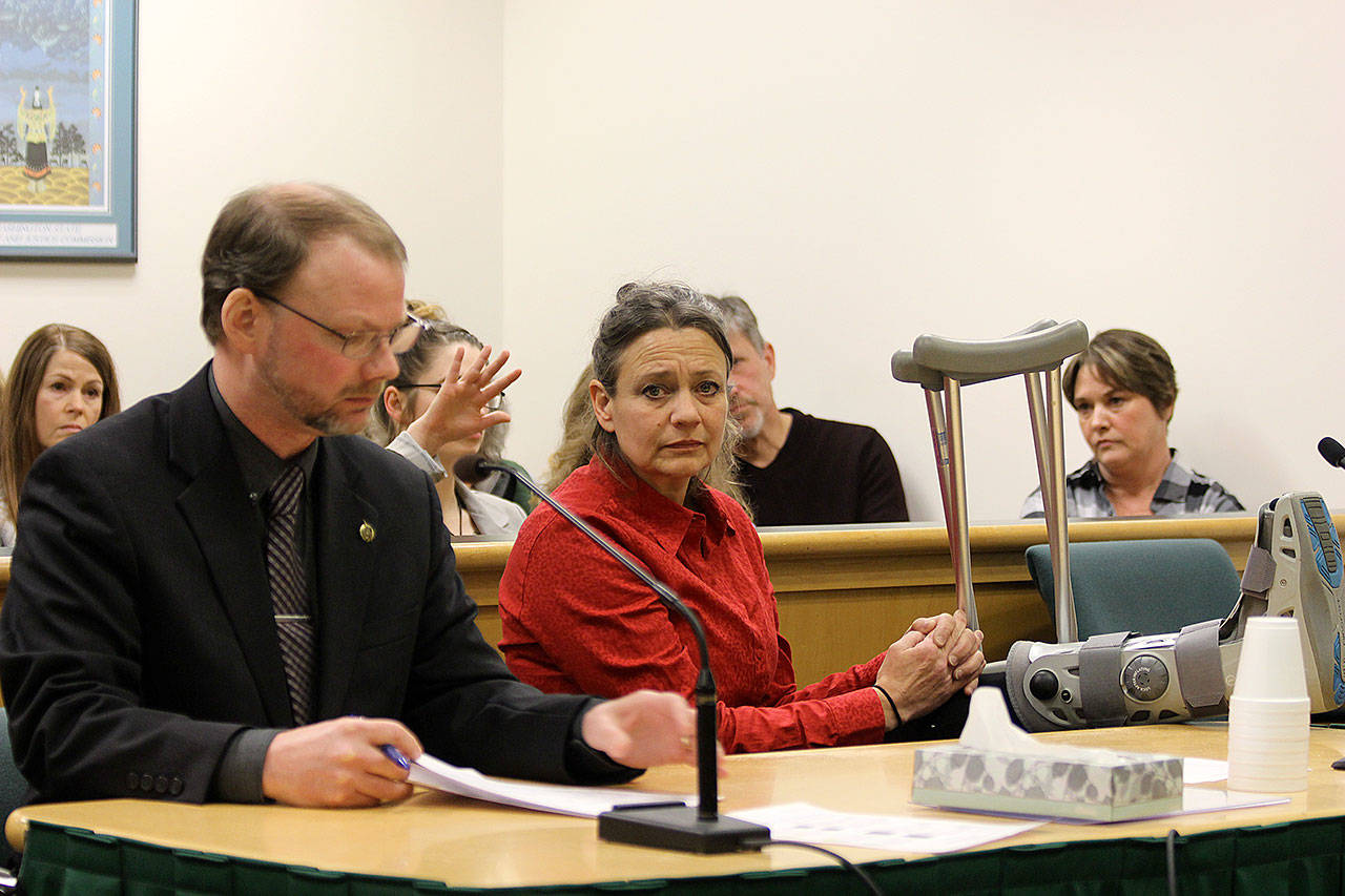 (Photo by Jessie Stensland / Whidbey News Group)                                Michelle Nichols, sitting next to attorney David Carman, was sentenced to more than 10 years in prison in Island County Superior Court Monday for vehicular homicide.