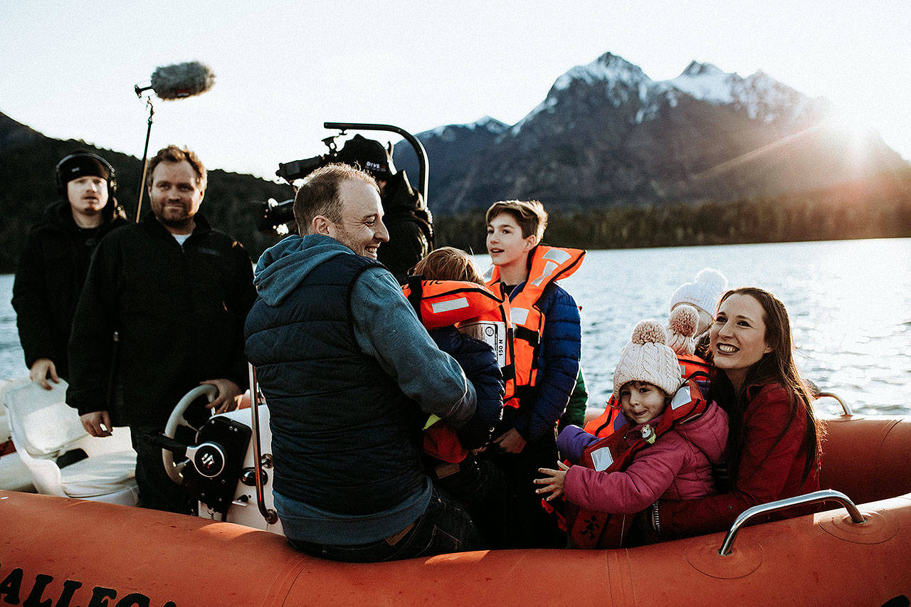 Andy Baldridge and Erica Saar-Baldridge and their children on a boat with a crew from HGTV’s “House Hunters International.” The couple decided to move to the Patagonia region of Argentina in December 2017. Photo by Brianne Belle