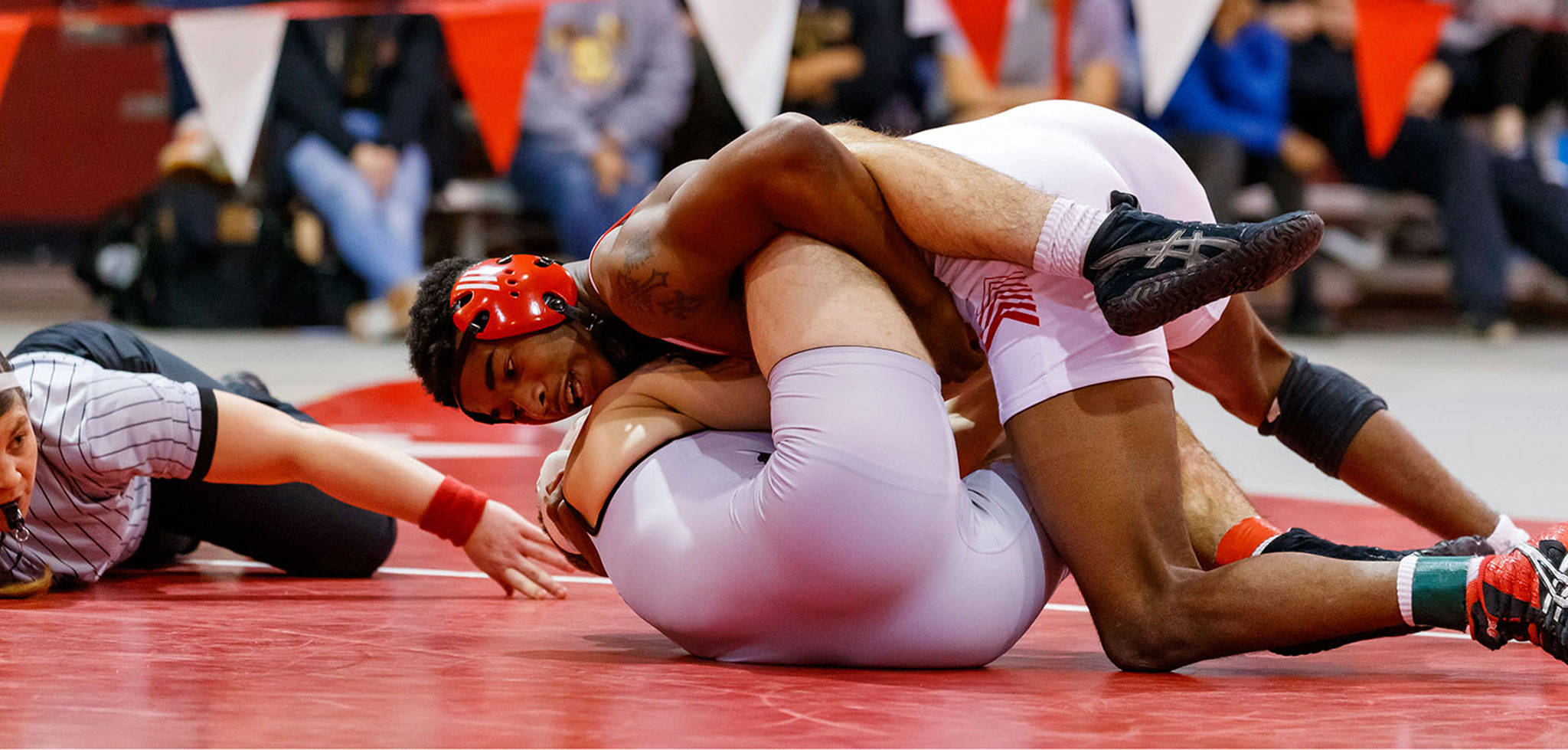 Oak Harbor graduate Jeremy Vester, top, goes for a pin this season while competing for Central College. (Photo by Dan L. Vanderbeek)