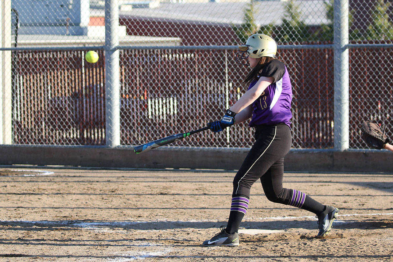 Madisyn Erbe puts the ball in play for the Wildcats.(Photo by John Fisken)