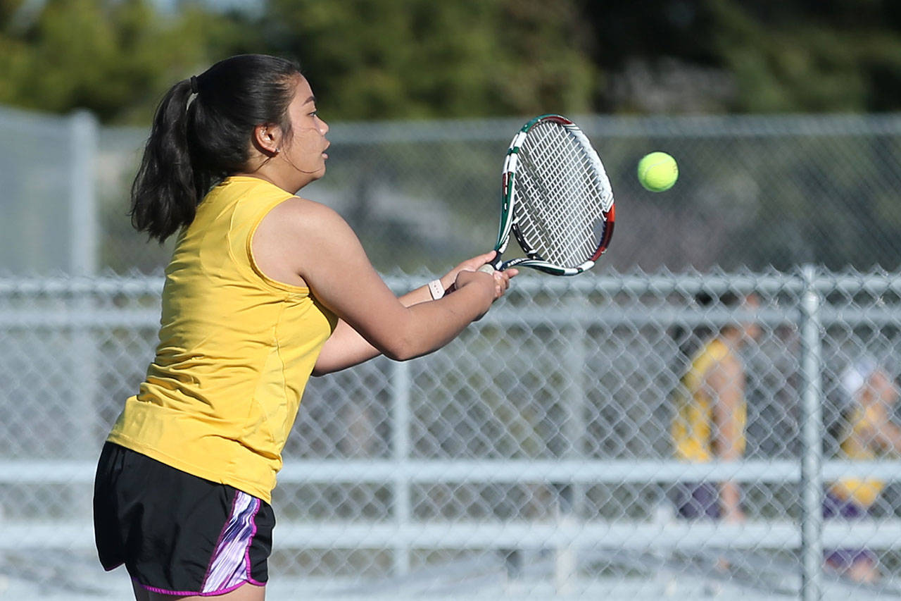 Elica Atienza returns a shot in her second doubles win with Olivia Lerch. (Photo by John Fisken)