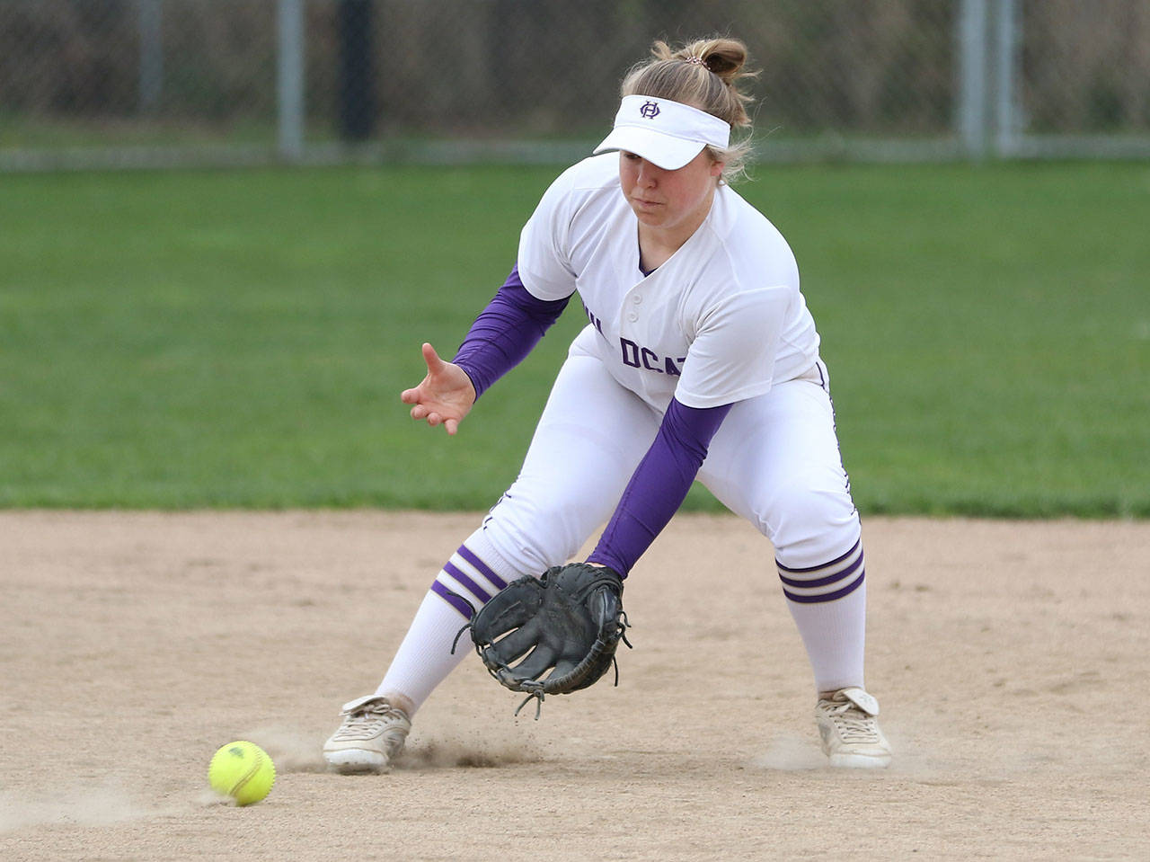 Oak Harbor shortstop Kayla Crocker looks in a ground ball. (Photo by John Fisken)