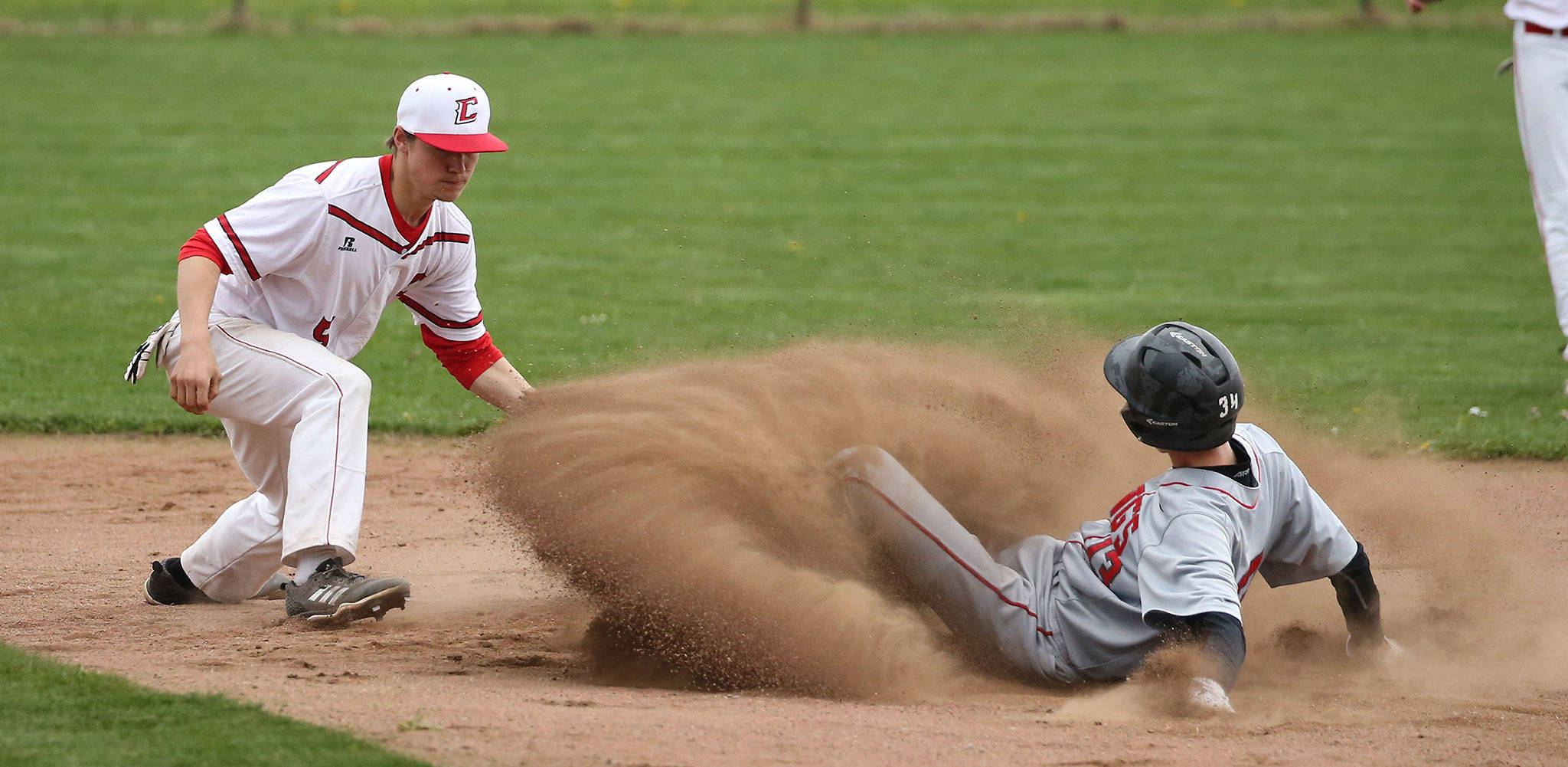 Coupeville shortstop Matt Hilborn greets a Kings baserunner at second base in Wednesdays game. (Photo by John Fisken)