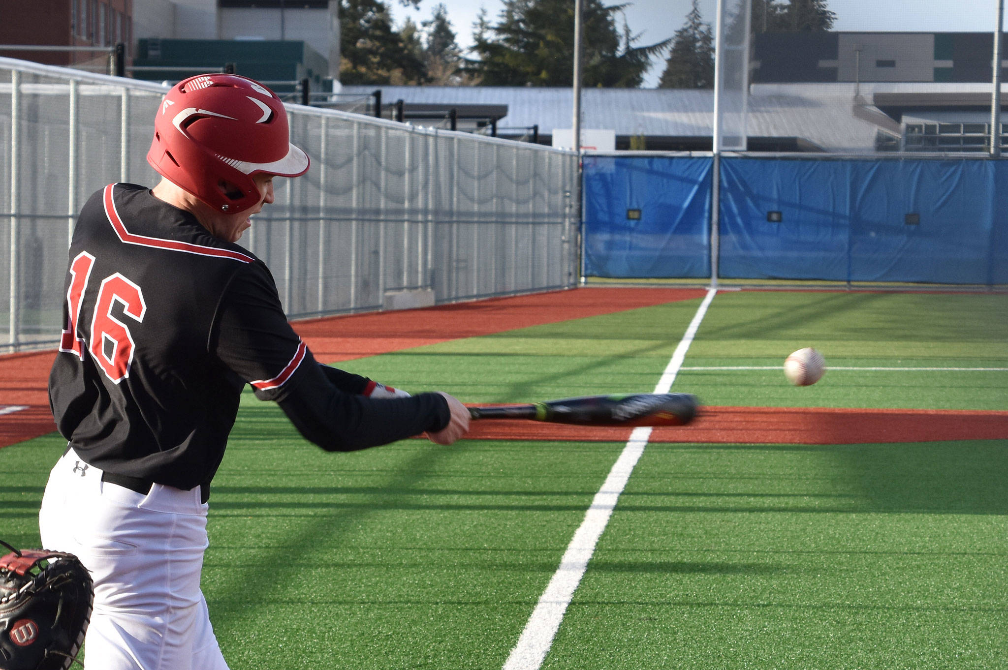 Coupeville’s Ulrik Wells attacks a pitch in Friday’s game with King’s.(Photo by Karen Carlson)