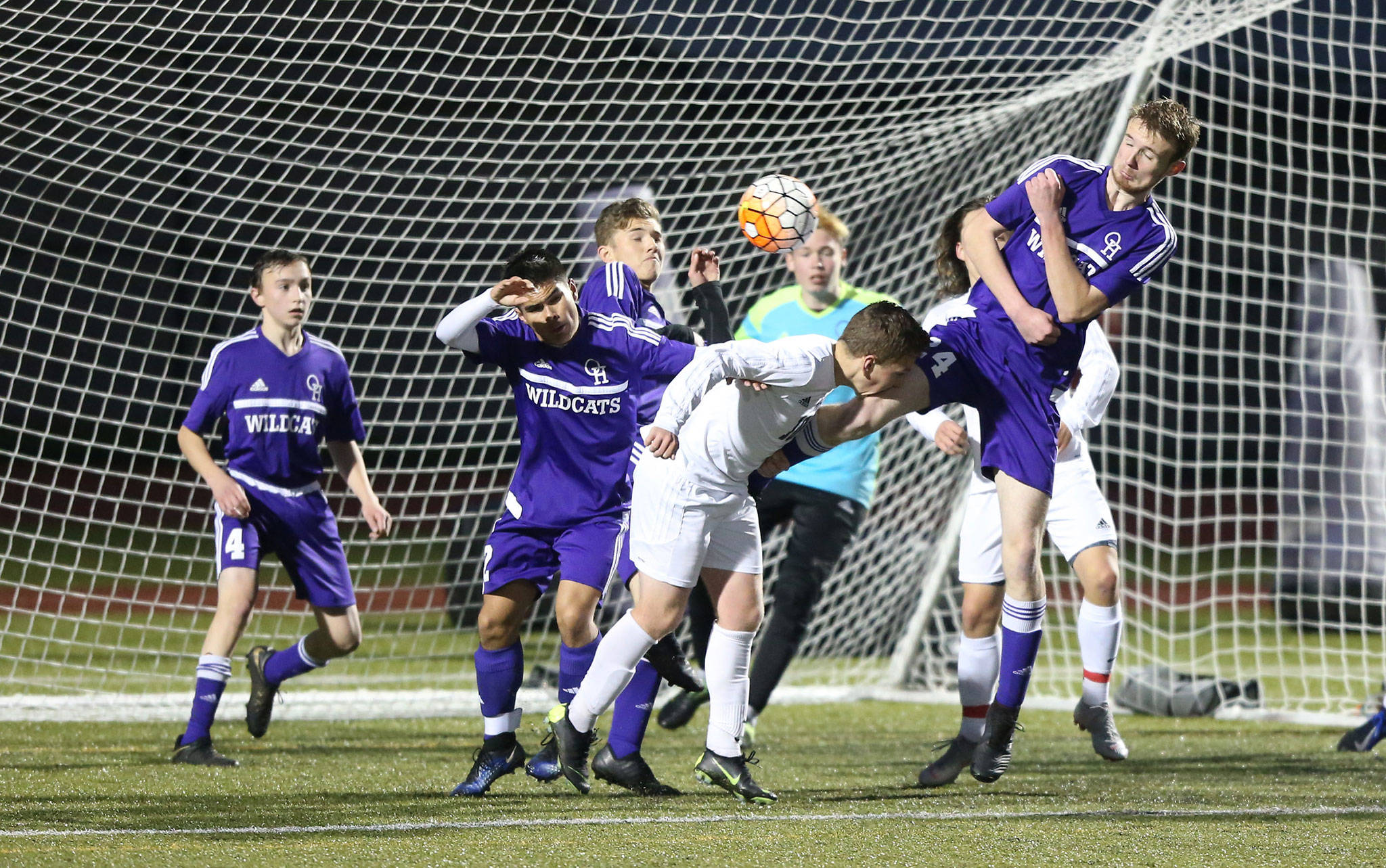 The Oak Harbor defense fights to turn back a Meadowdale attack Monday night.(Photo by John Fisken)