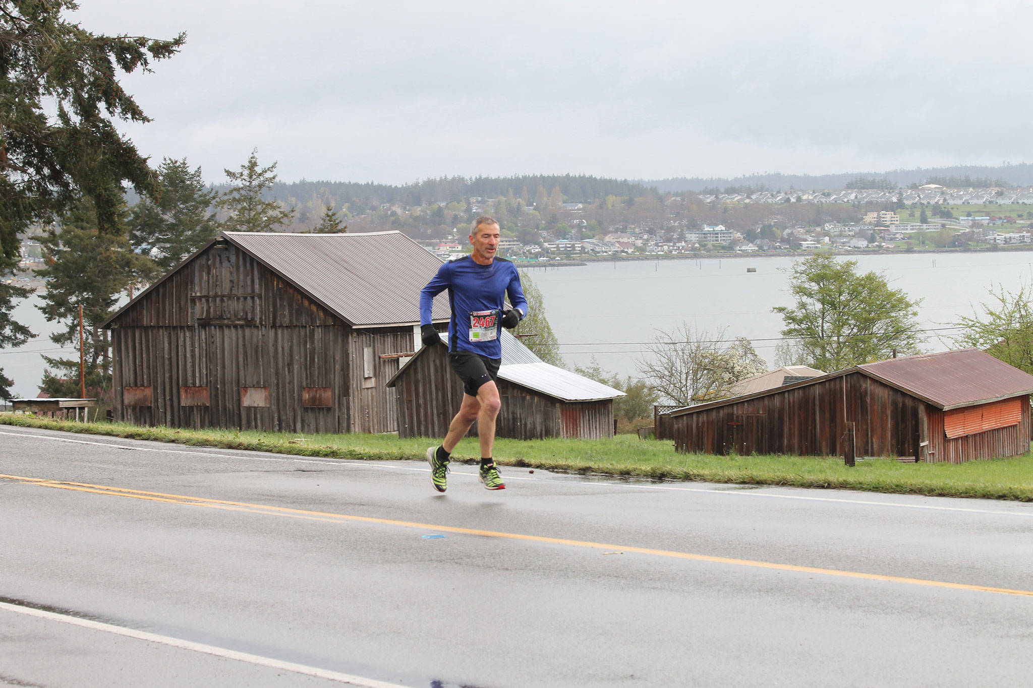 A runner heads up Balda Road during the half marathon Sunday. (Photo by Jim Waller/Whidbey News-Times)
