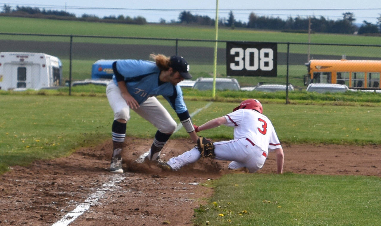 Mason Grove slides safely into third base in Monday’s win over Sultan. (Photo by Karen Carlson)