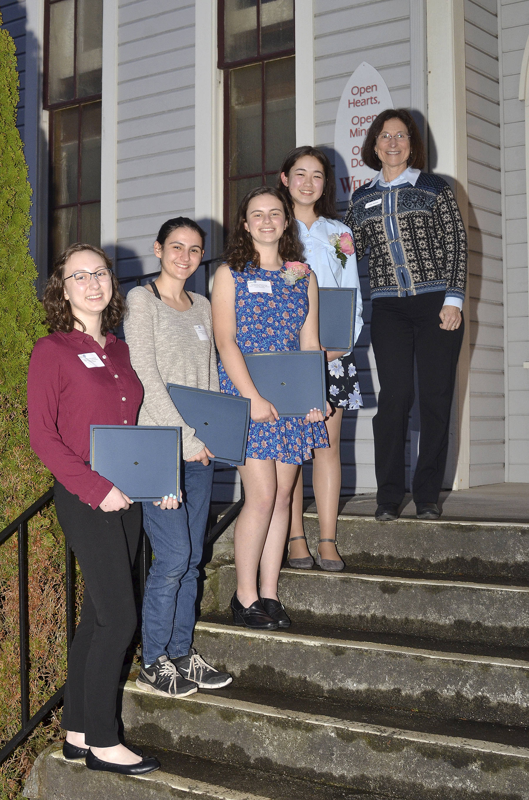 Photos provided. Pictured from left to right are scholarship recipients Natalie Hahn of Oak Harbor High School, Madison Rixe of Coupeville High School, Carli Newman of South Whidbey High School, Sierra Brackeen of Oak Harbor High School, and AAUW Academic Scholar Chair Angie Homola.