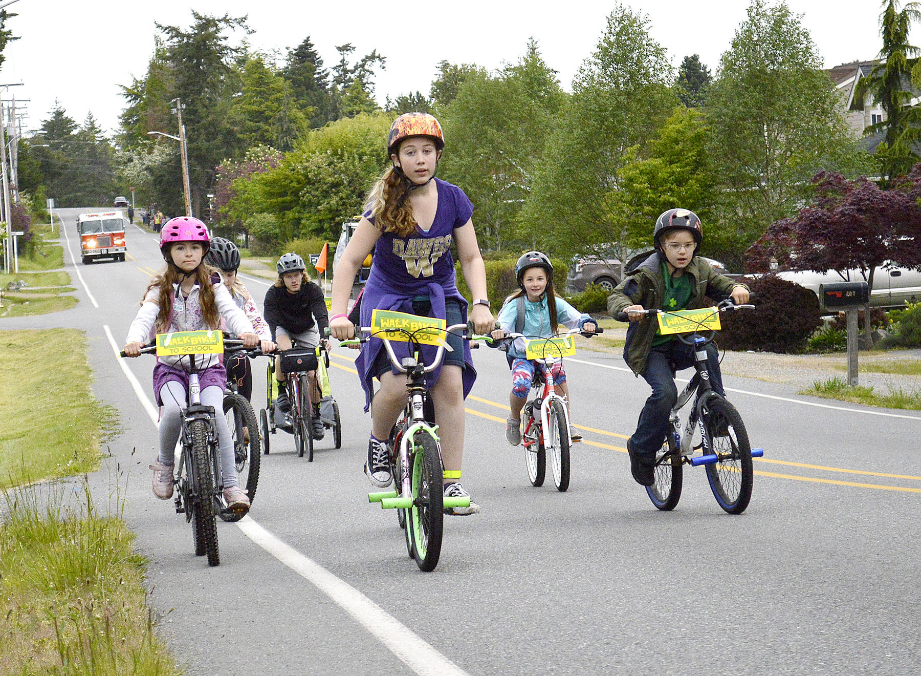 Approximately 55 Coupeville Elementary School fourth and fifth graders took to the streets, safely of course, Wednesday morning for the second annual Bike to School Day. Law enforcement and Central Whidbey Island Fire and Rescue escorted the bikers, and walkers, as part of the national initiative by the National Center for Safe Routes to School. (Photo by Laura Guido/Whidbey News-Times)