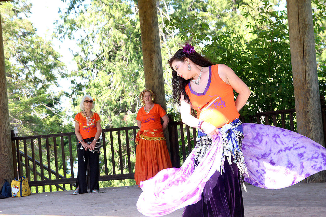 (Photo by Laura Guido/Whidbey News-Times)                                Belly dance teacher Chandani Teresa Ortego performs a solo dance Saturday at Coupeville Town Park as part of the 2019 Shimmy Mob. The event, which also took place in Langley, raised money for Citizens Against Domestic & Sexual Abuse.