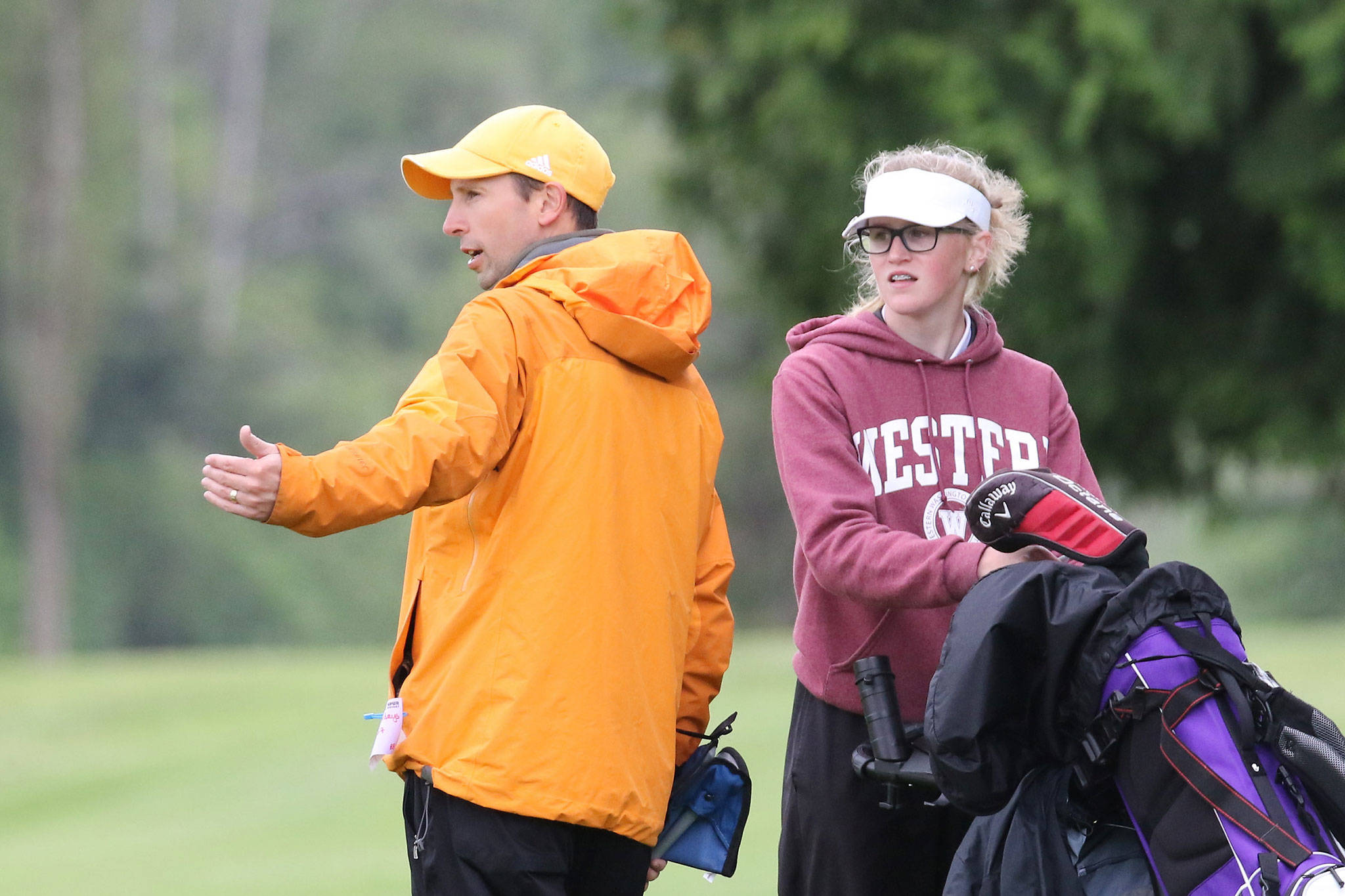 Oak Harbor coach Andy Wesley and Sara Rhodes discuss strategy during the district tournament.(Photo by John Fisken)