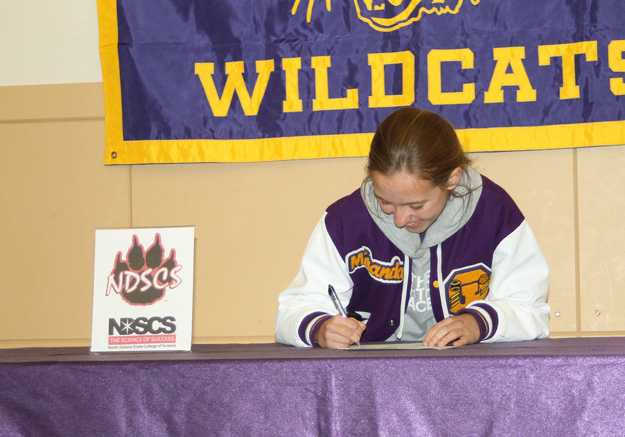 Oak Harbor High School senior Miranda Wilson signs a letter of intent to play softball for North Dakota State College of Science. (Photo by Jim Waller/Whidbey News-Times)