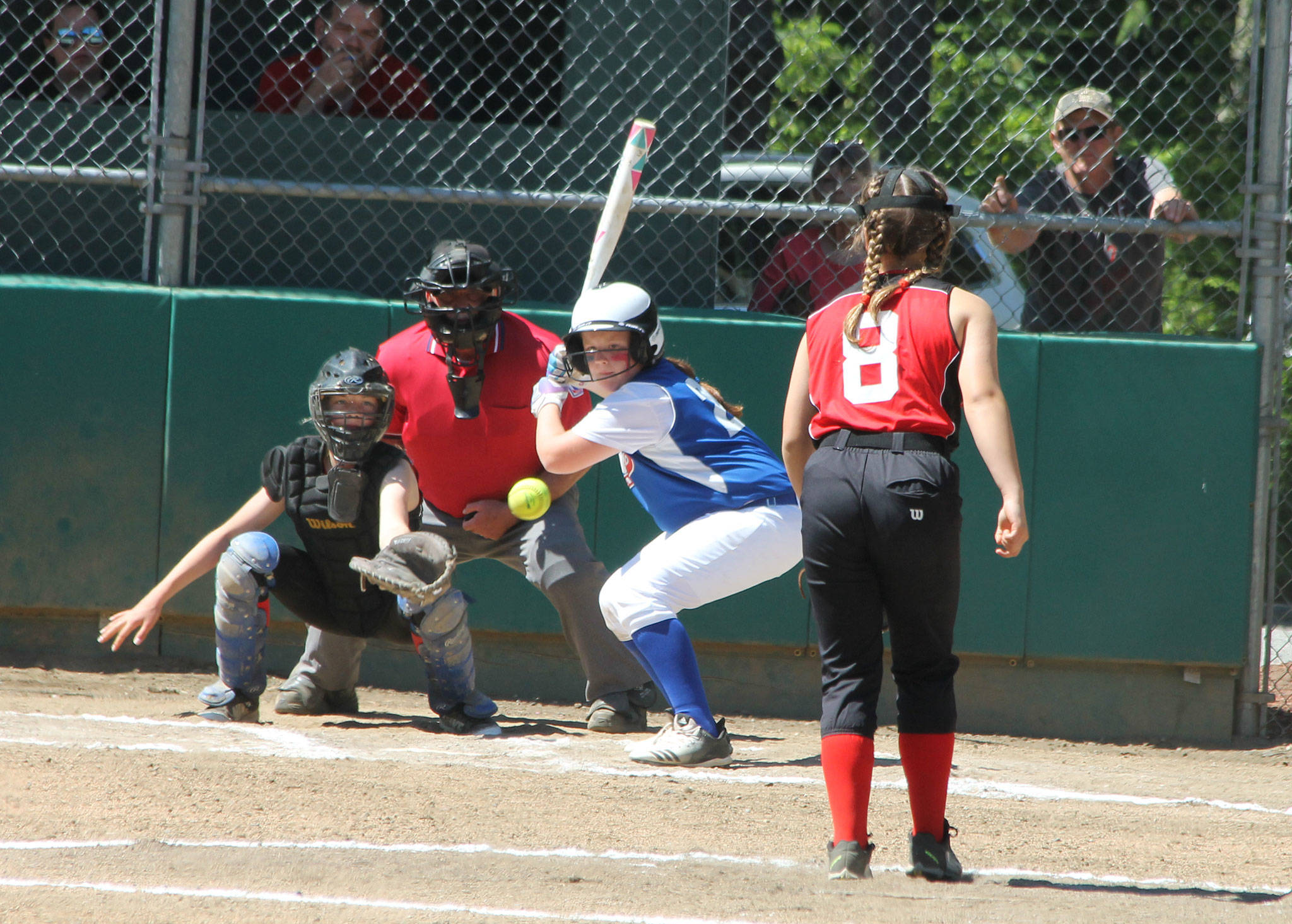 Pitcher Chloe Marzocca fires a strike to catcher Savina Wells.(Photo by Jim Waller/Whidbey News-Times)
