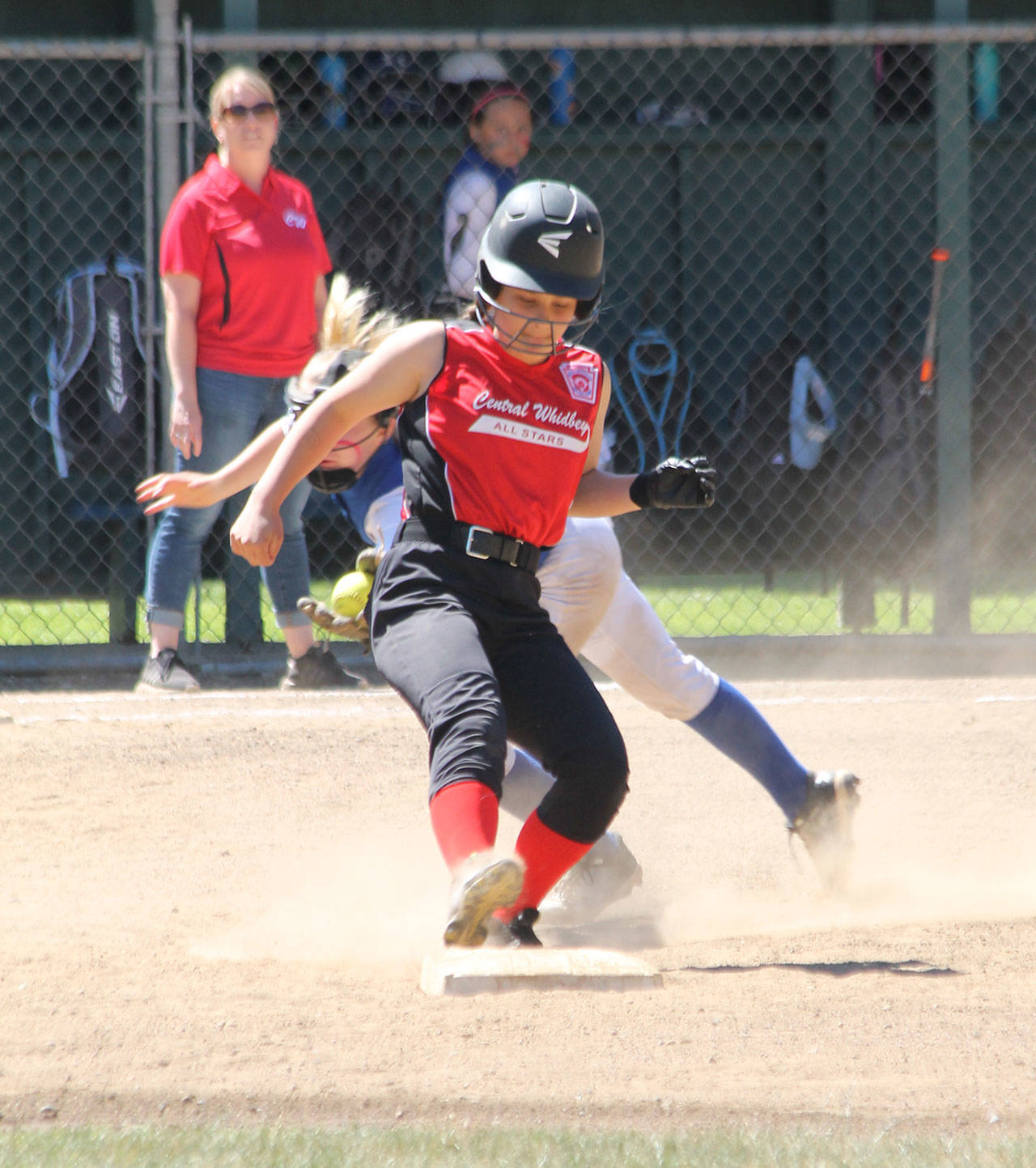 Chloe Marzcocca avoids a tag at second base.(Photo by Jim Waller/Whidbey News-Times)