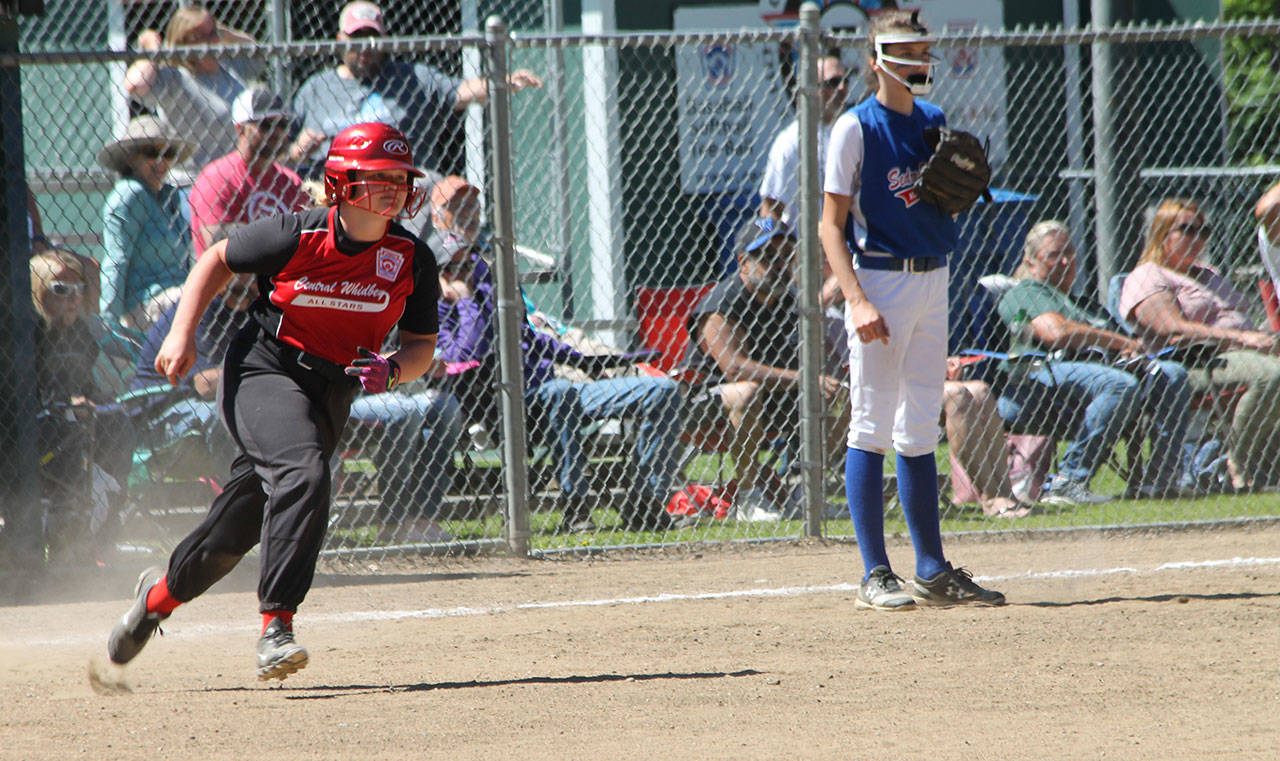 McMillan steams toward second base during her triple.(Photo by Jim Waller/Whidbey News-Times)