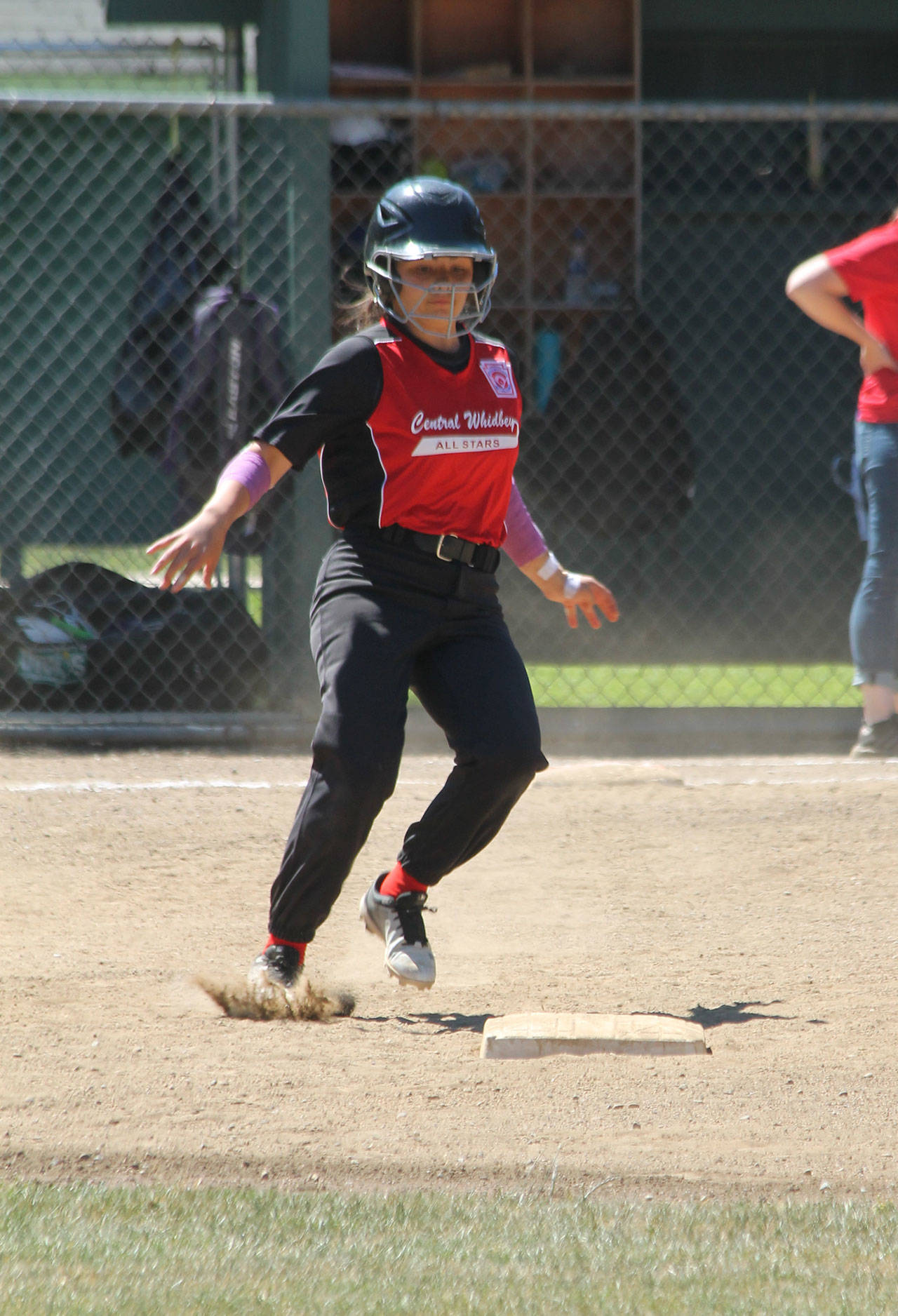 Allison Nastali puts on the brakes as she steals second base.(Photo by Jim Waller/Whidbey News-Times)
