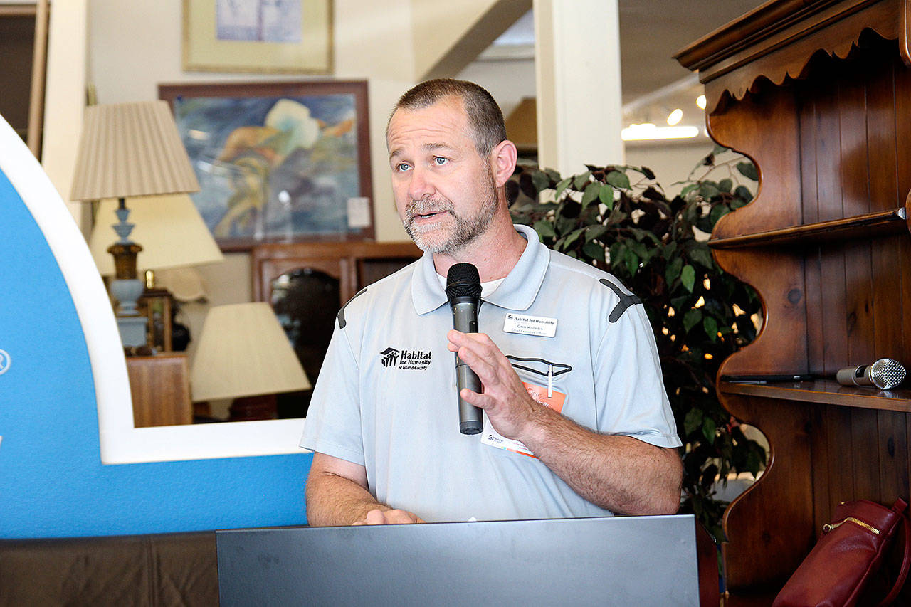 Orin Kolaitis, CEO of Habitat for Humanity of Island County, speaks at a recent event hosted at the nonprofit’s store in Oak Harbor. (Photo by Laura Guido/Whidbey News-Times)