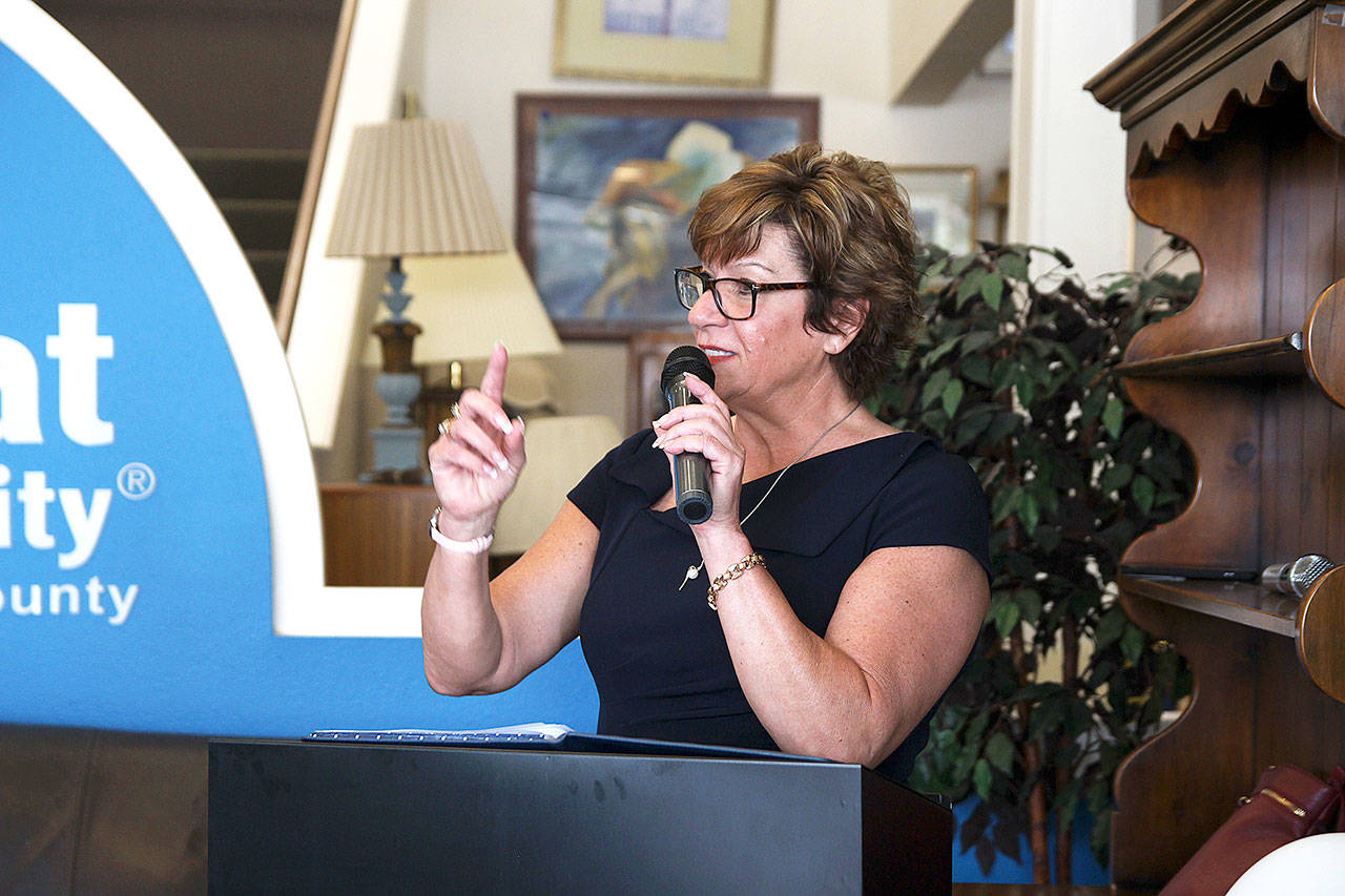 Oak Harbor Chamber of Commerce Executive Director Christine Cribb speaks at a recent event at the Habitat for Humanity storein Oak Harbor. The nonprofit is launching its “Cost of a Home” campaign to bring awareness to the need for affordable housing. (Photo by Laura Guido/Whidbey News-Times)