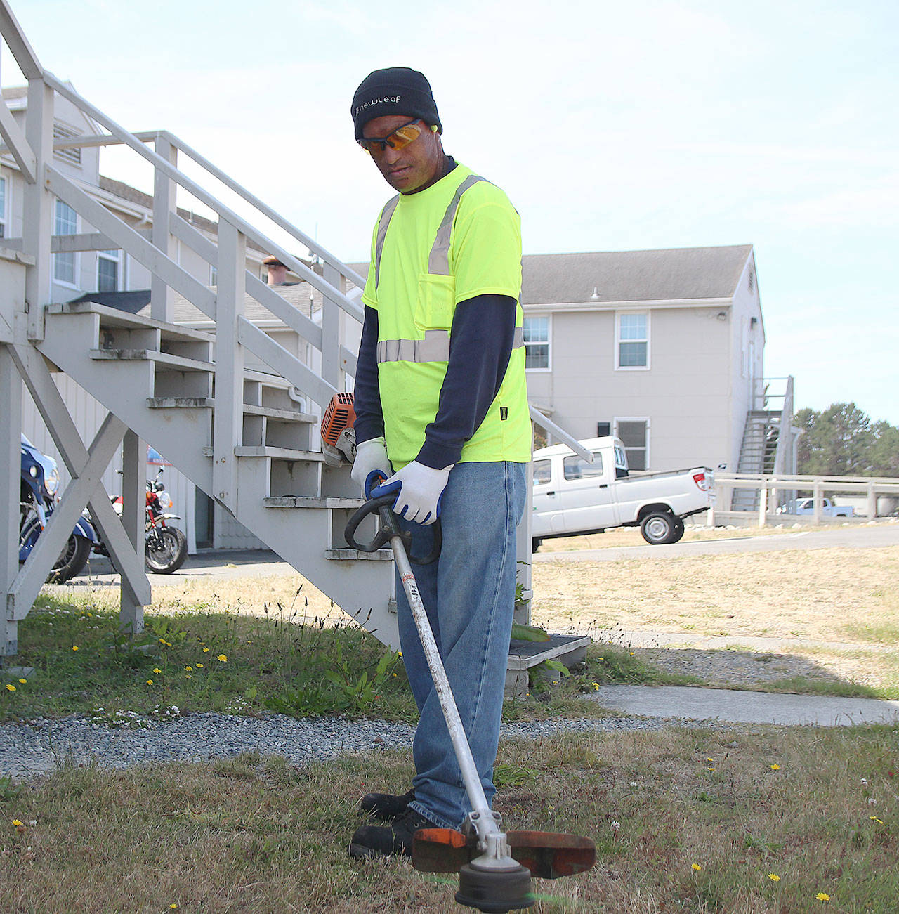 Photos by Laura Guido/Whidbey News-Times                                Gene Pulu works on the New Leaf grounds crew at Naval Air Station Whidbey Island. He was recently recognized by the base commander for his work.