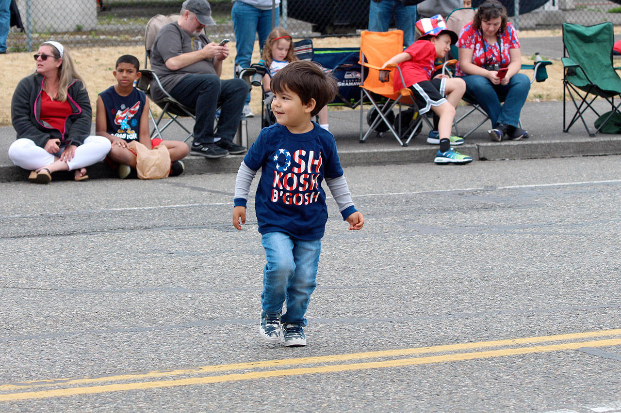 Lucas Handke, 2-and-a-half-years-old, dances before the parade begins.