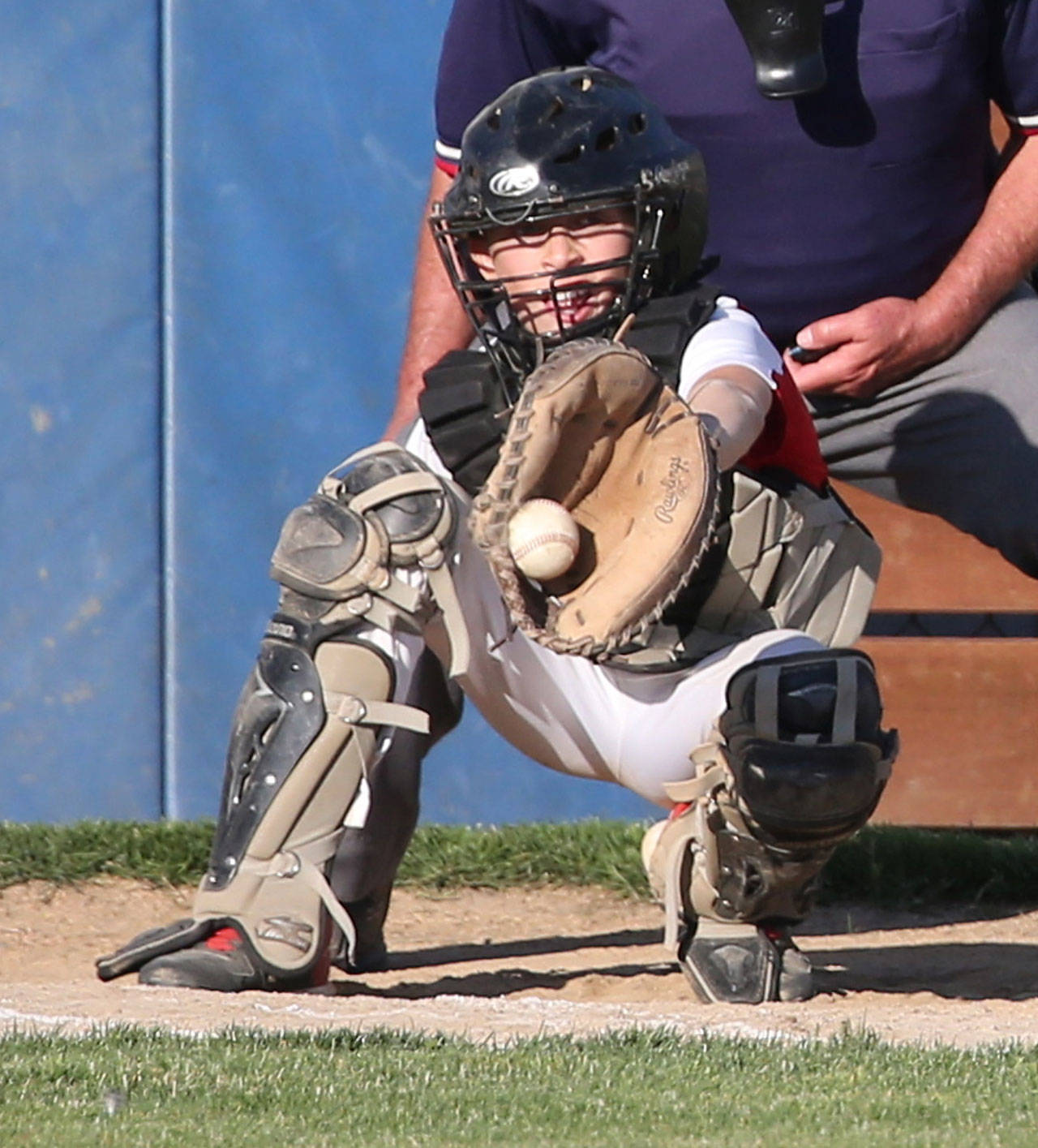 Central Whidbey catcher Chase Anderson looks in a pitch. (Photo by John Fisken)