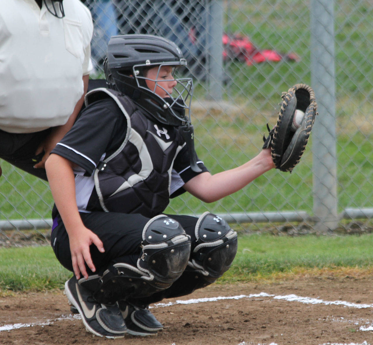 Catcher Meyer Brayden frames a pitch for North Whidbey. (Photo by Jim Waller/Whidbey News-Times)