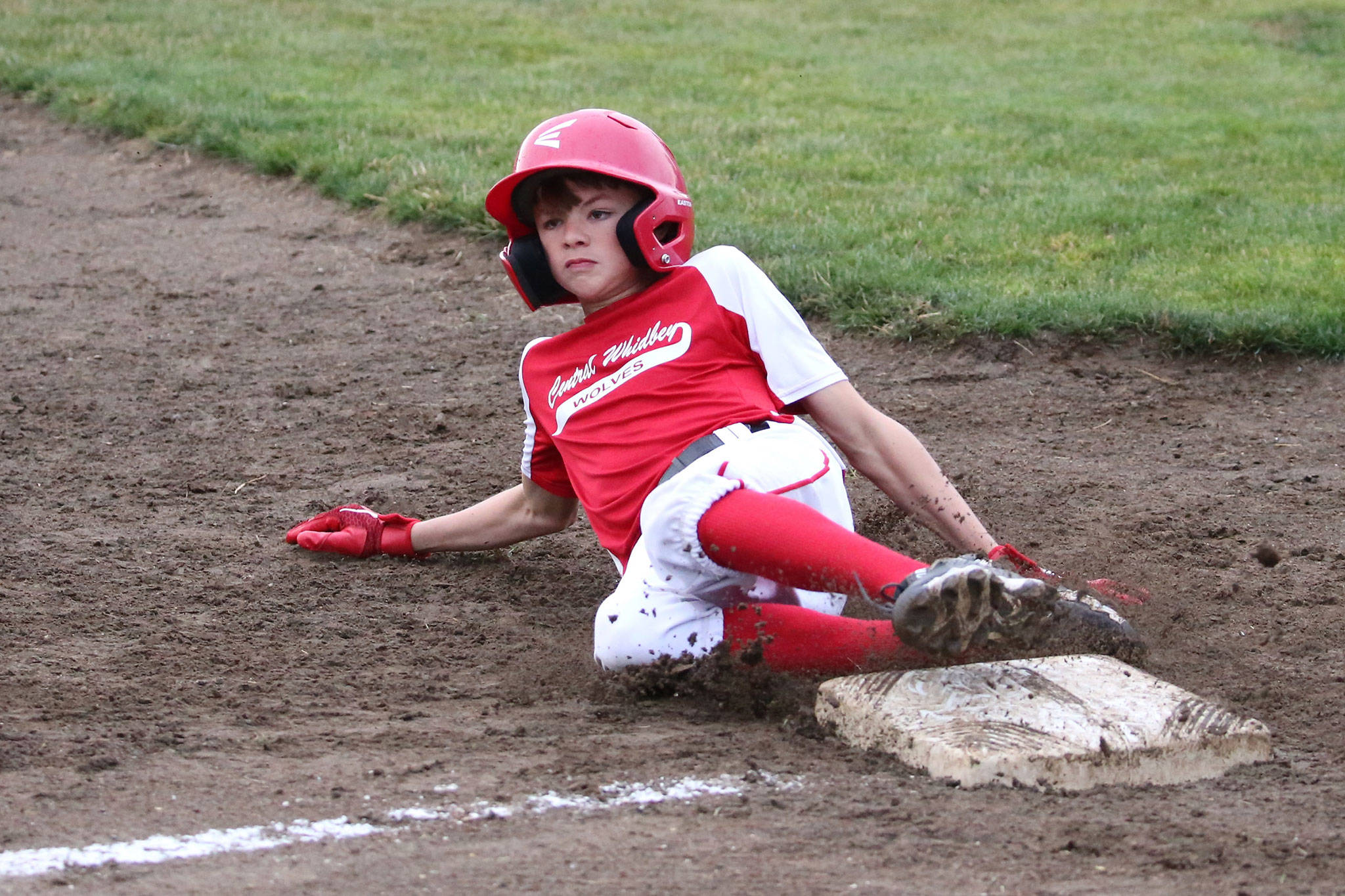 Jack Porter slides safely into third base in Central Whidbey’s win over Sedro-Woolley Wednesday. (Photo by John Fisken)