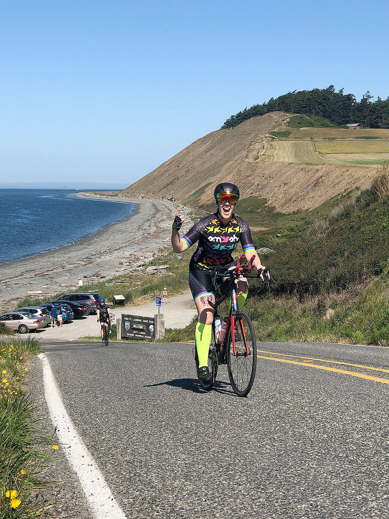 Jen Wuest of Clinton climbs a hill near Ebey’s Landing as she tackles the 20-mile route of the Sea, Trees Pie Bike Ride on Central Whidbey Island Sunday. Photo courtesy of Ron Newberry