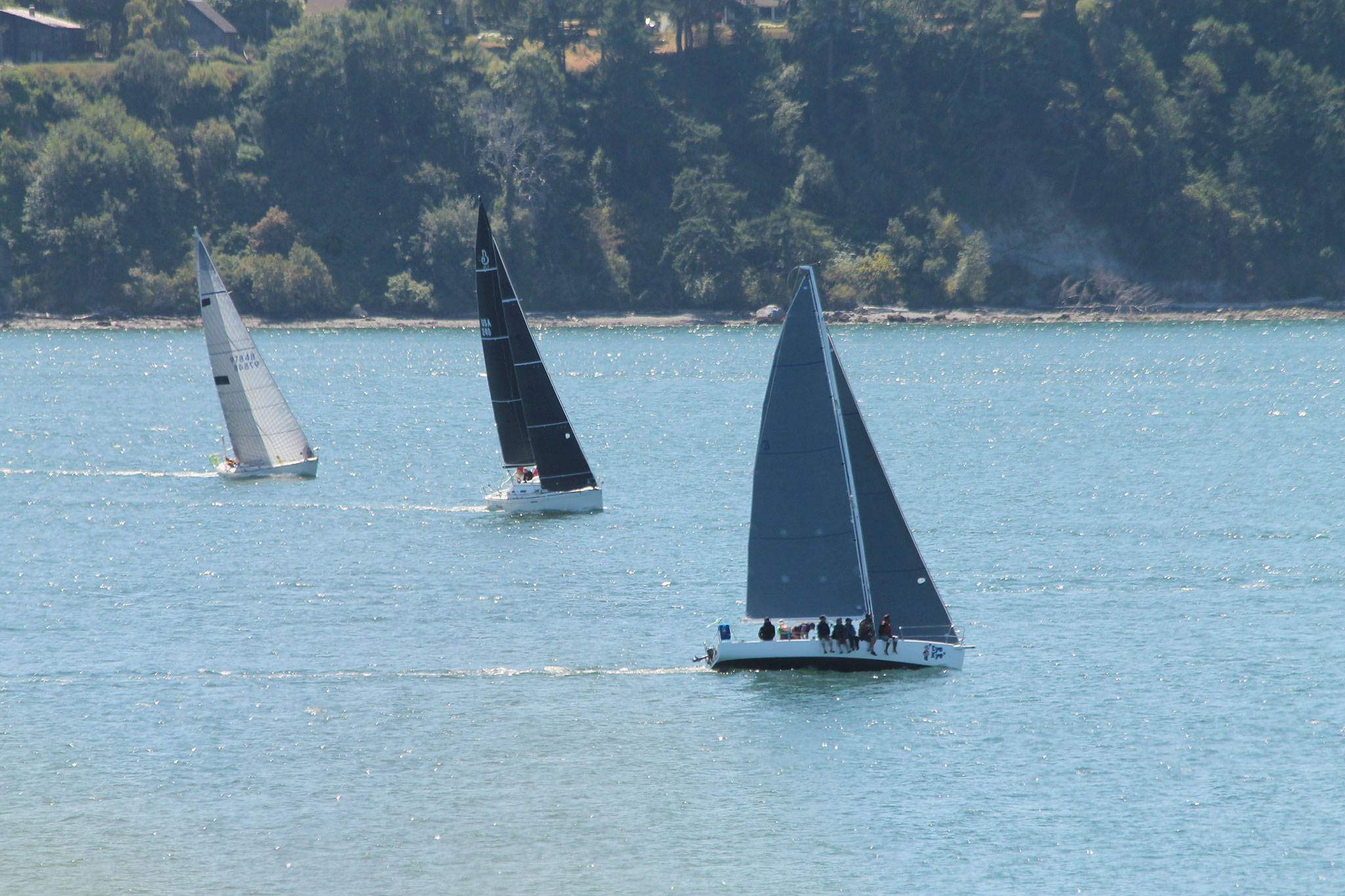 Photo by Jim Waller/Whidbey News-Times                                Boats skim across the waters of Penn Cove in the final Whidbey Island Race Week.