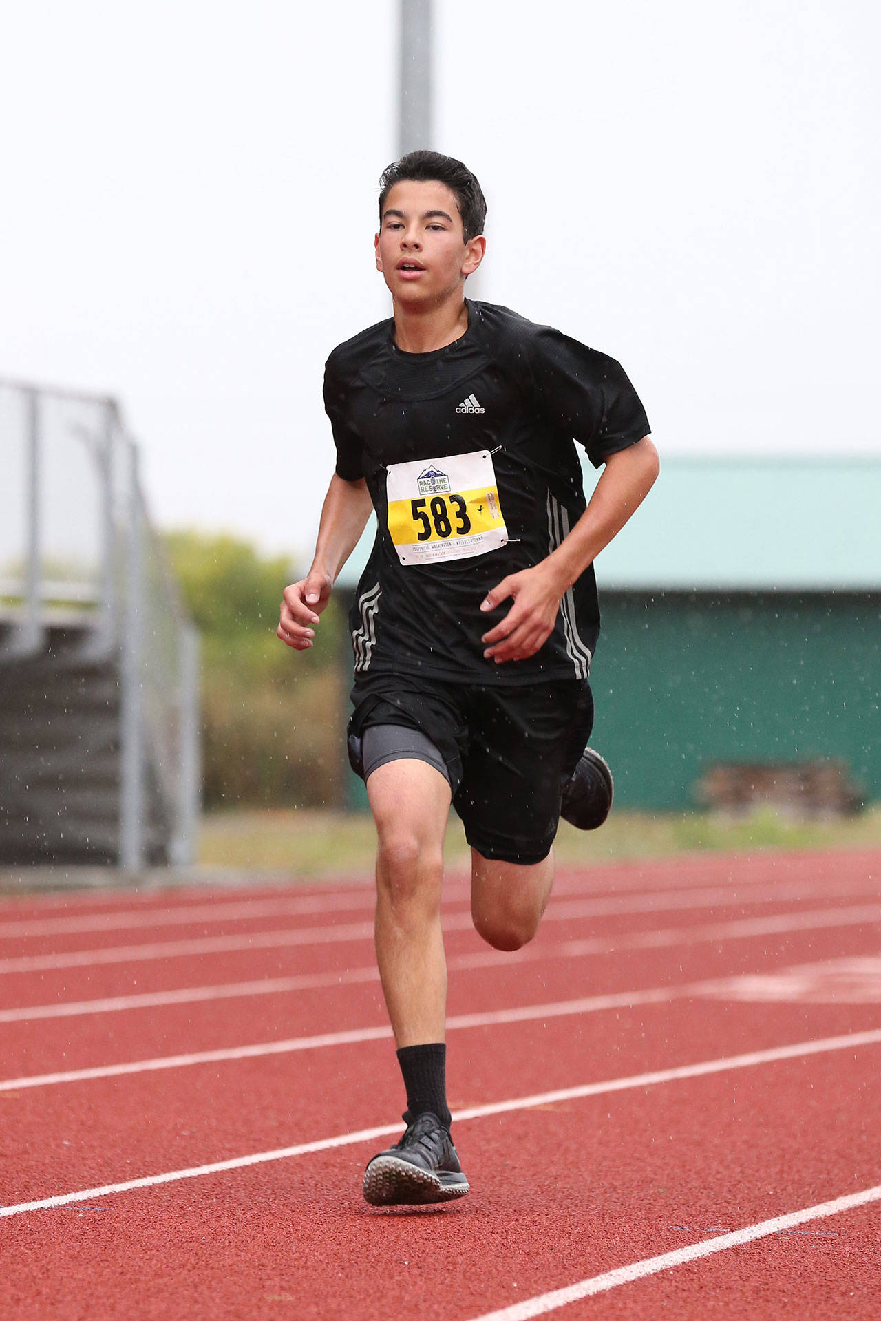 Oak Harbor’s Jacob Pearson finished first in the 5K at the Race the Reserve Saturday.(Photo by John Fisken)