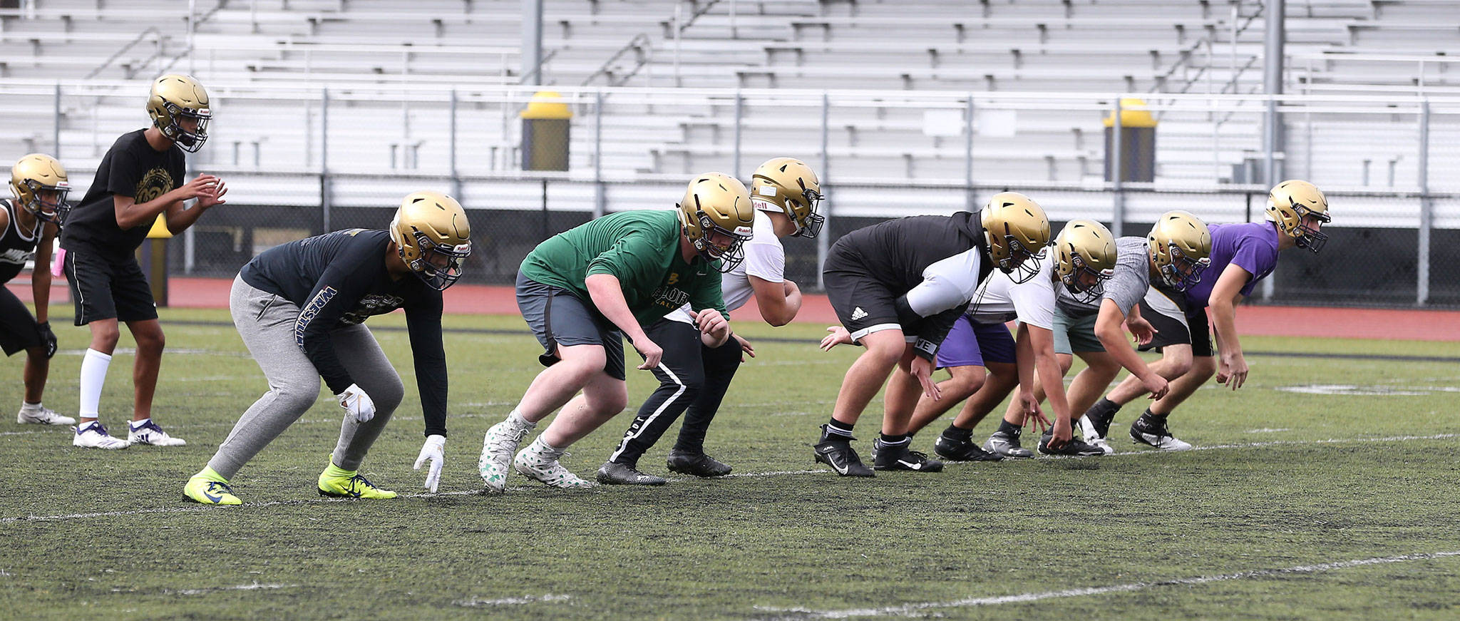 Oak Harbor fires off the line during the first day of football practice Wednesday. (Photo by John Fisken)