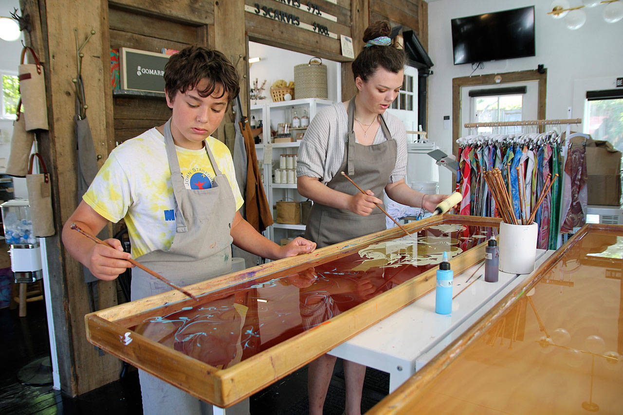 Siblings 13-year-old Jack Culligan and 16-year-old Cate try their hand at marbling a scarf. (Photos by Maria Matson/Whidbey News-Times)