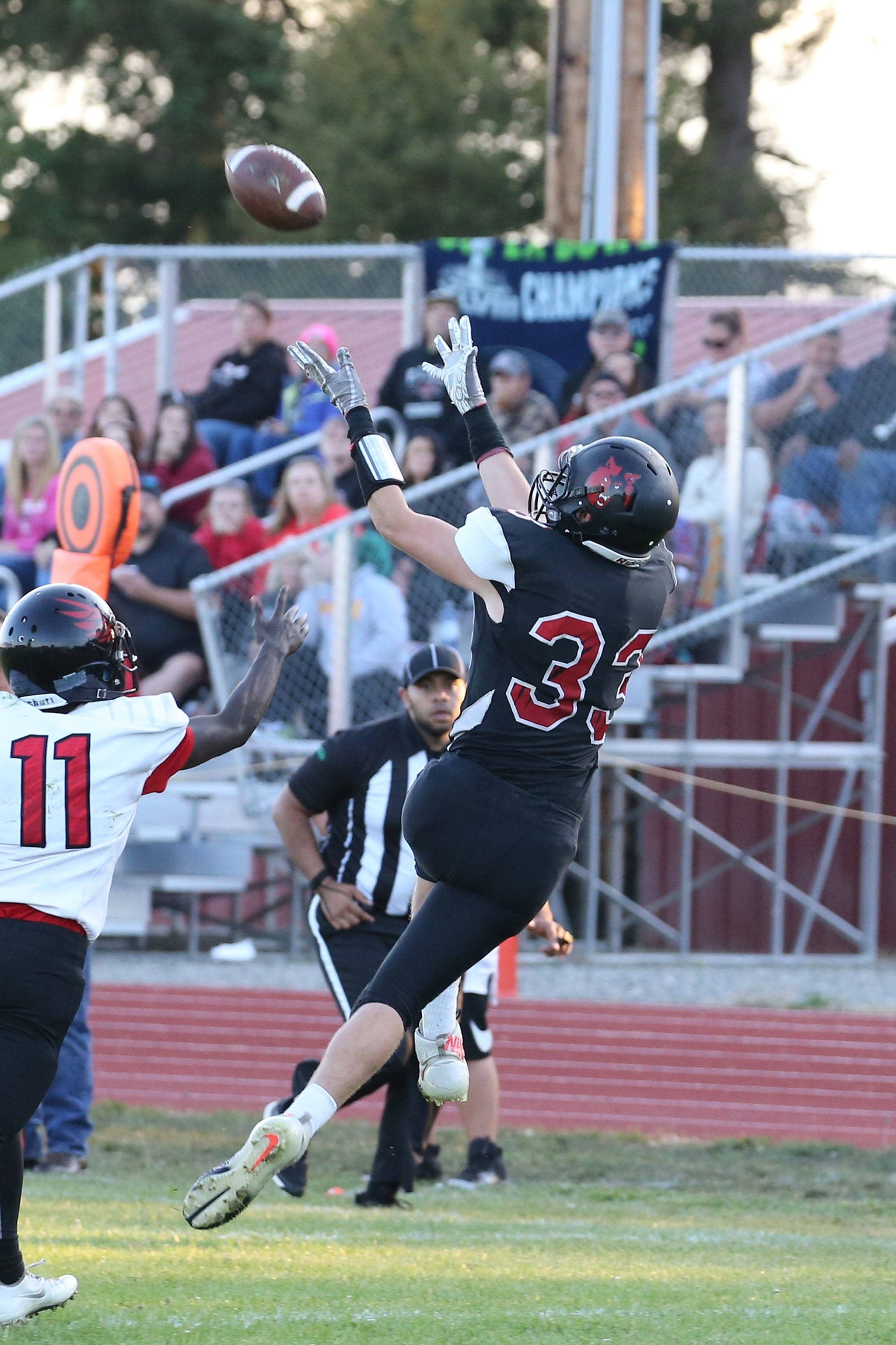 Gavin Knoblich hauls in a pass from Dawson Houston in Coupevilles season opener Friday. (Photo by John Fisken)