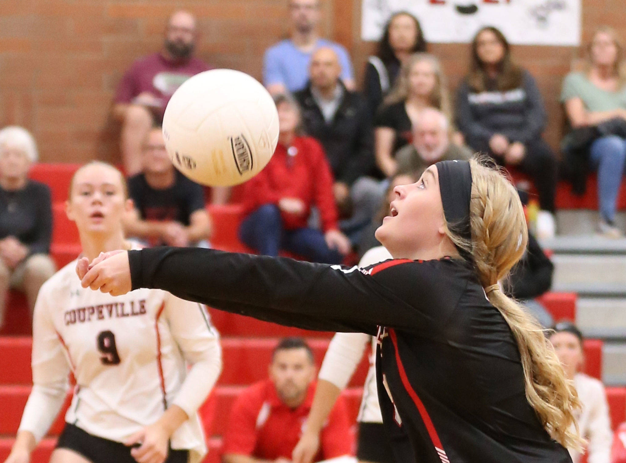 Emma Mathusek passes the ball for Coupeville in the Wolves’ win Tuesday. Mathusek collected 18 digs in the match.(Photo by John Fisken)