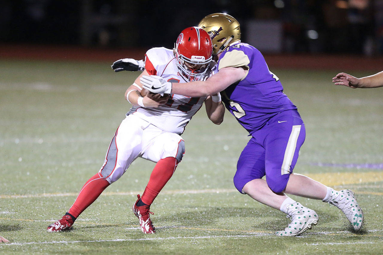 Cameron Hoppock takes down Stanwood quarterback Caden Lukehart.(Photo by John Fisken)