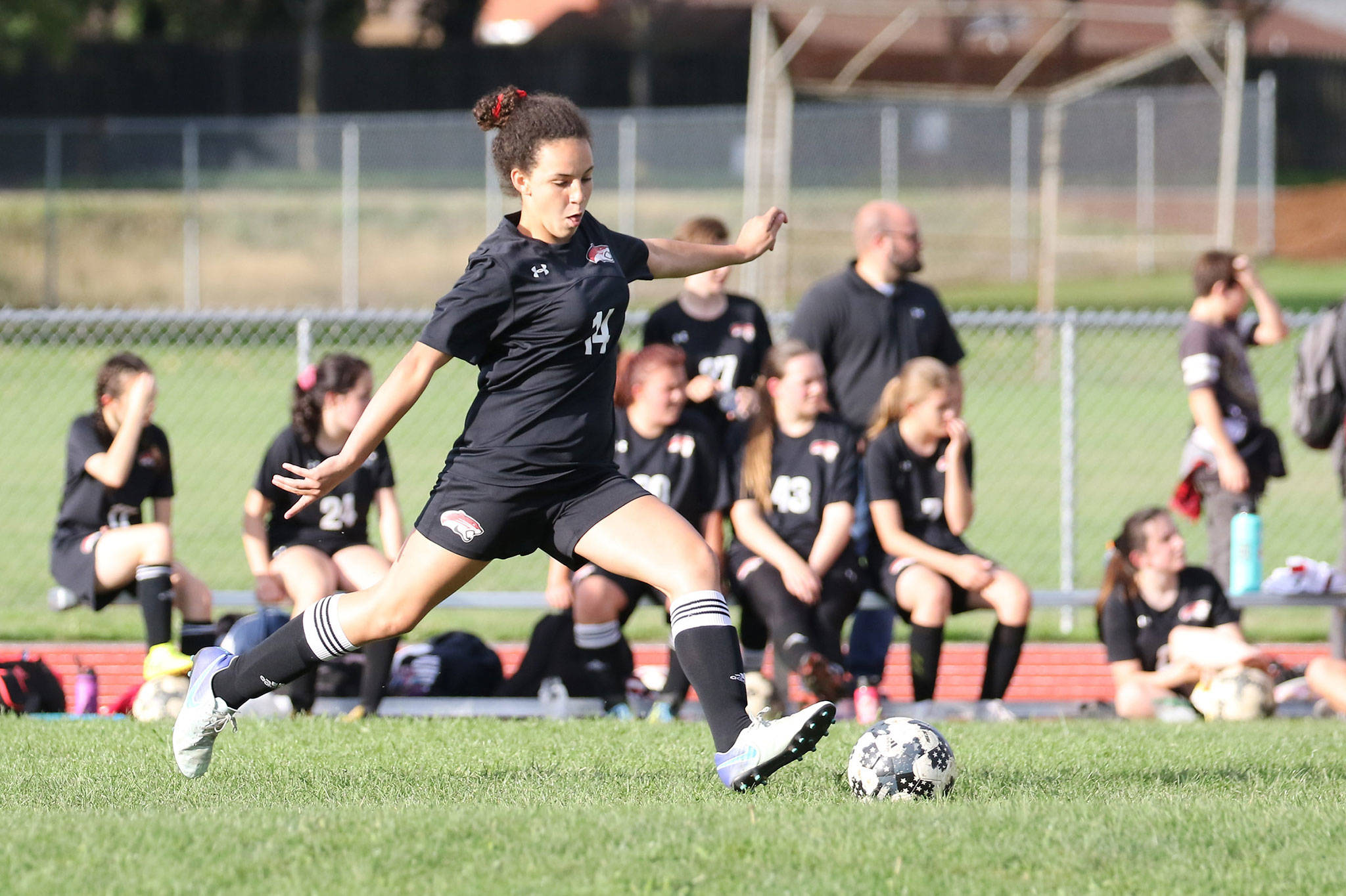 Varsity defender Lily Atkins boots the ball for the Cougars in their match with Conway Thursday.(Photo by John Fisken)