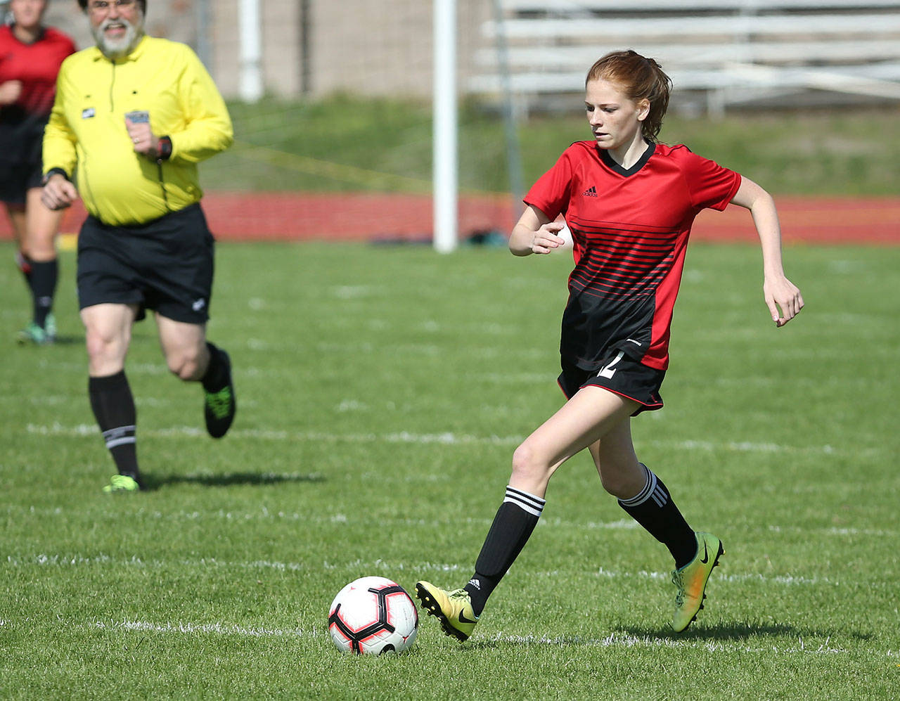 Anna Dion dribbles the ball up the field Saturday.(Photo by John Fisken)
