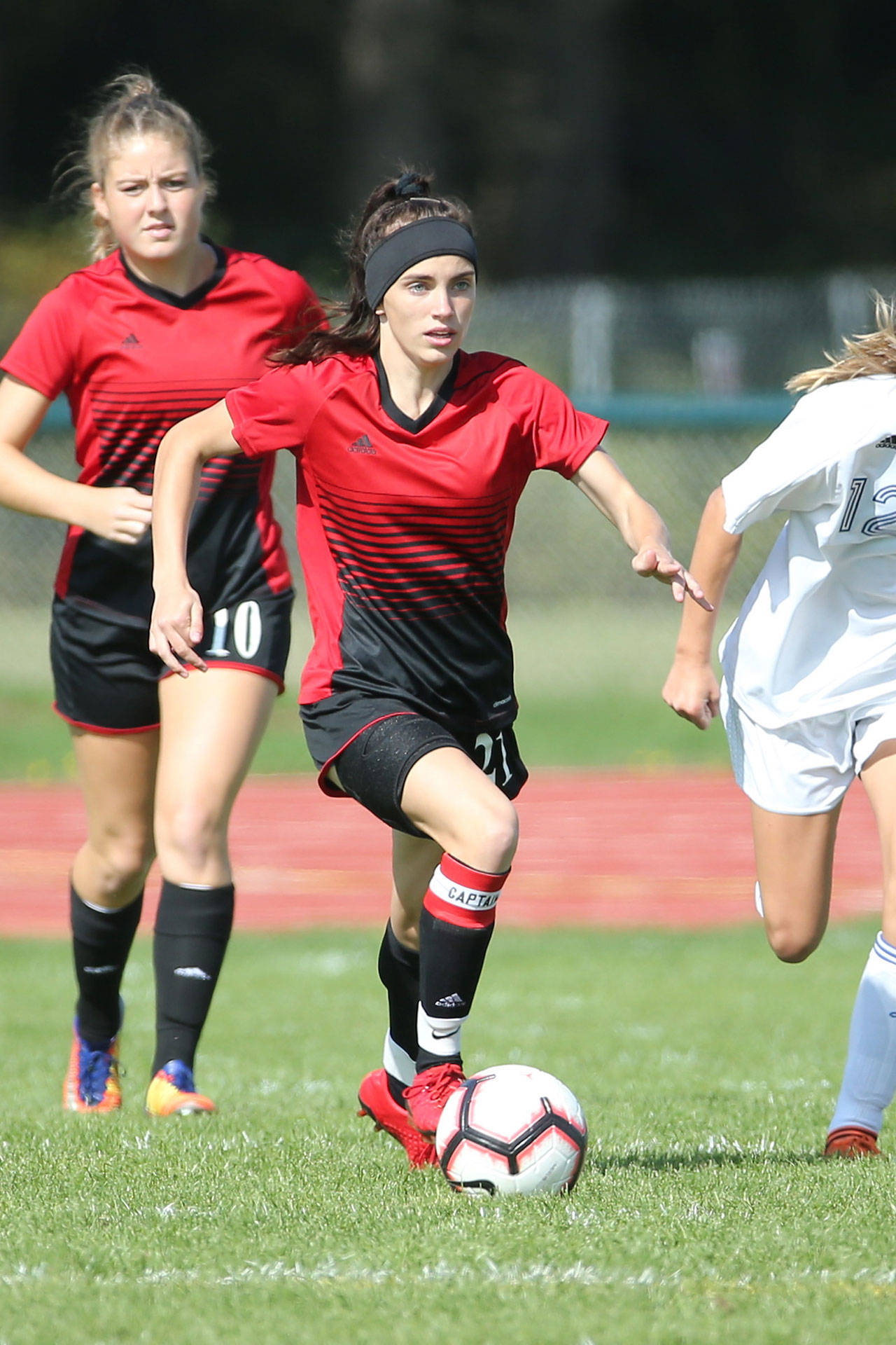 Mallory Kortuem races the ball up the field.(Photo by John Fisken)