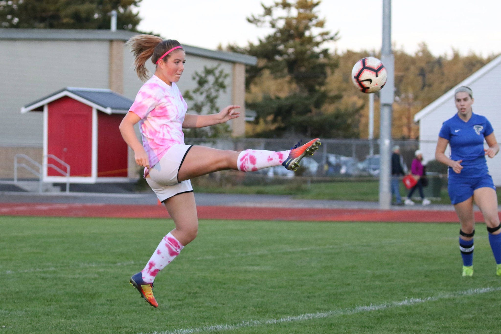 Coupeville’s Natalie Hollrigel boots the ball in the Wolves’ match with South Whidbey Tuesday.(Photo by John Fisken)