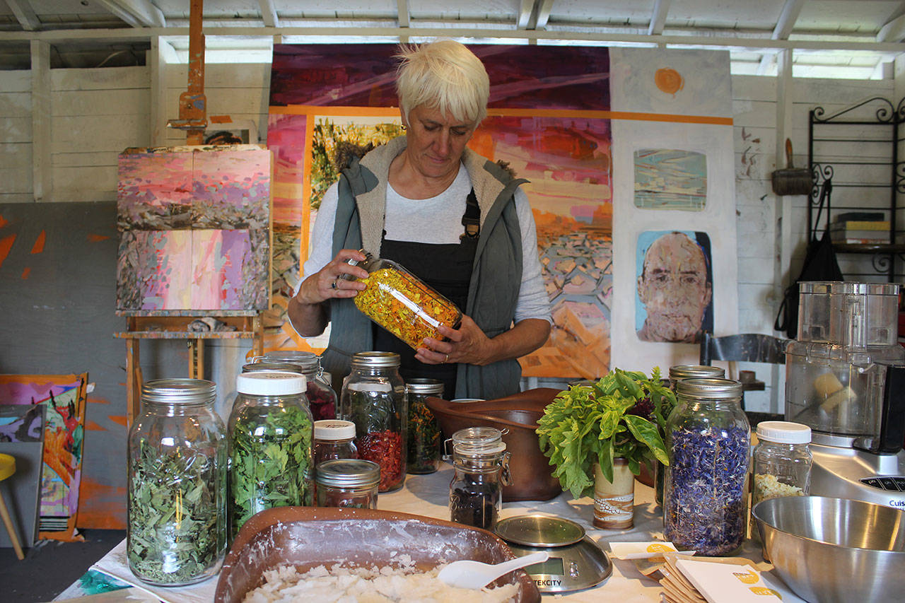Kim Gruetter from Salty Acre Farm on Whidbey Island mixes herbs and edible flowers into natural sea salt blends. Photo by Wendy Leigh / South Whidbey Record